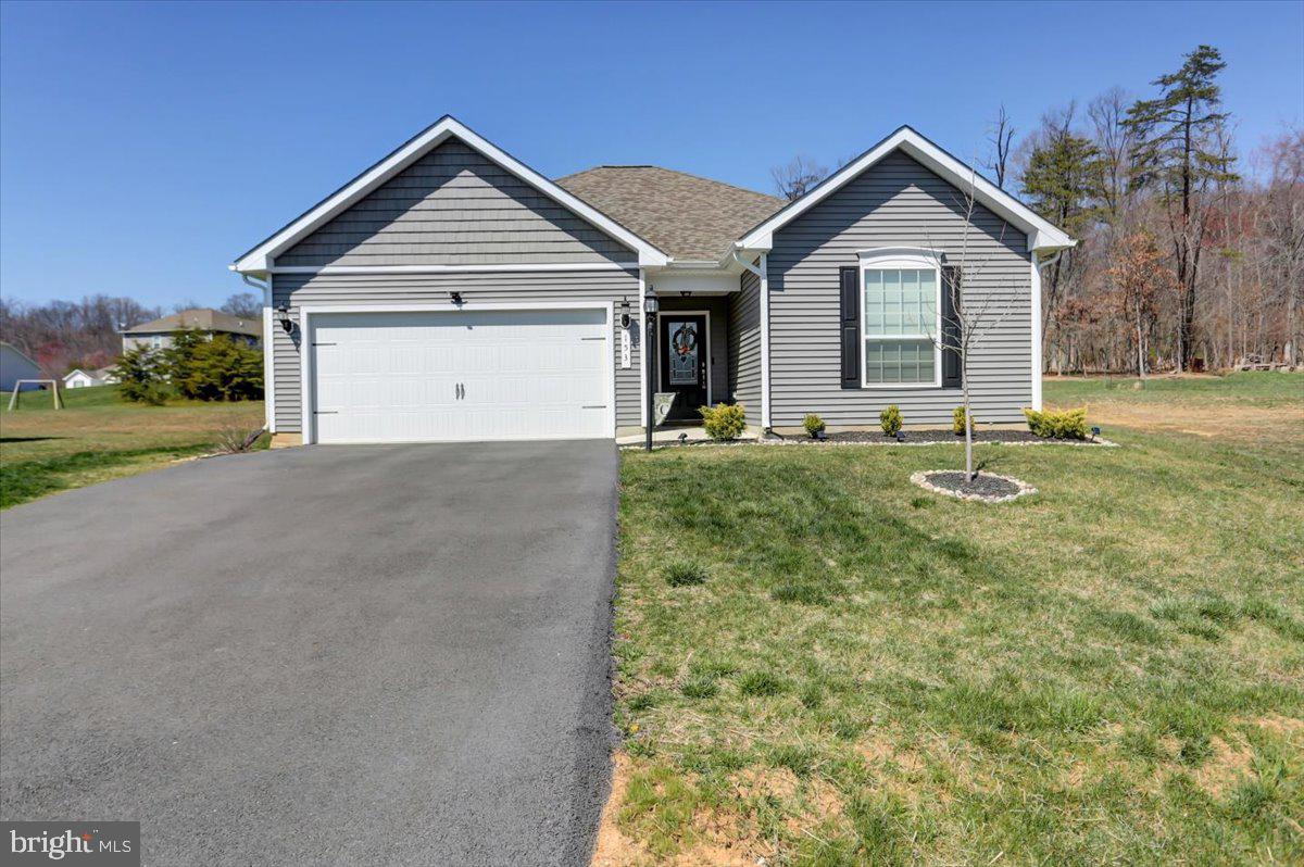 Move into this well-maintained riverside home just in time for summer!  This adorable open concept ranch home is only 3 years old.  It sits on over half an acre and backs up to trees for privacy.  The front has ample curb appeal with beautiful landscaping and the back is a clean slate with endless possibilities.

The home has 3 bedrooms, two full bathrooms, and a great room which combines living room and kitchen/dining areas -perfect for entertaining!  The kitchen comes equipped with granite countertops, a pantry for storage, and a large island.  This home has lovely upgraded finishes including custom lighting fixtures in each room, a ceramic tile backsplash, and window treatments for privacy on every window.

The split floor plan provides a private retreat in the primary bedroom.  The master ensuite is situated at the back of the home.  Complete with a large walk-in closet and a beautiful bathroom with upgraded granite sink countertop.

This home comes with access to a private park with walking trails, picnic areas, a playground and a boat ramp to access to the Potomac River. Give me a call for your private tour!!!