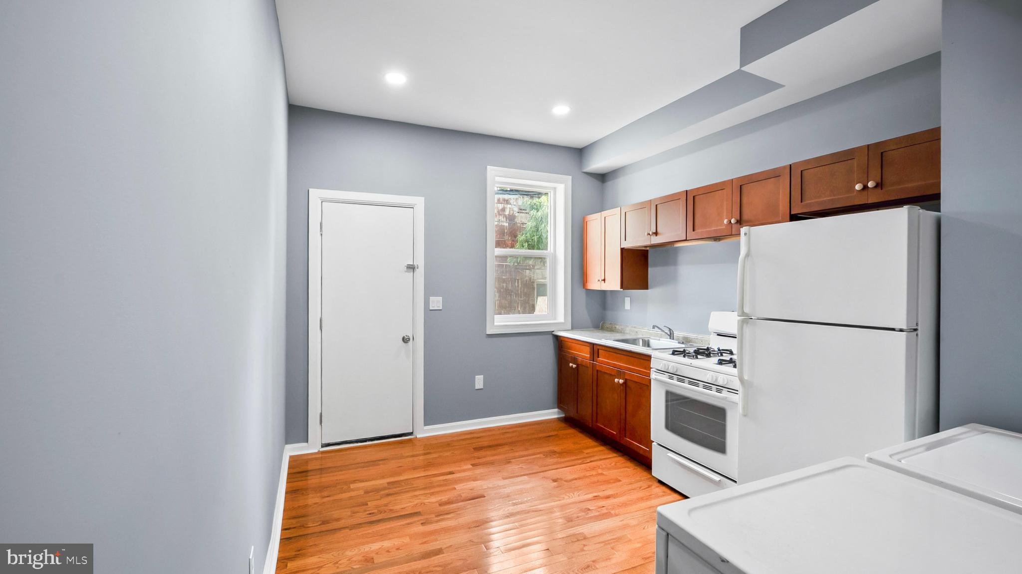 Recently renovated and thoughtfully updated, this property offers a turnkey opportunity for both investors and owner-occupants seeking long-term value. Completed months ago, the renovation was done with full permits and passed all required city inspections. The home has not been occupied since completion, offering a clean and refreshed interior ready for immediate use. Major improvements include a new electrical system, updated plumbing and gas lines, new HVAC, water heater, flooring, kitchen finishes and appliances, along with fresh paint and modern fixtures throughout. The home also includes a stove, refrigerator, washer, and dryer. The basement provides additional usable space, and the fenced rear yard offers privacy and outdoor flexibility. With rental projections between $1,850 and $2,000 per month, this property presents strong income potential and a compelling return at the current price point. All required rental documentation is already in place, including Certificate of Occupancy, active rental license, property registration, and lead certification, allowing for immediate leasing.