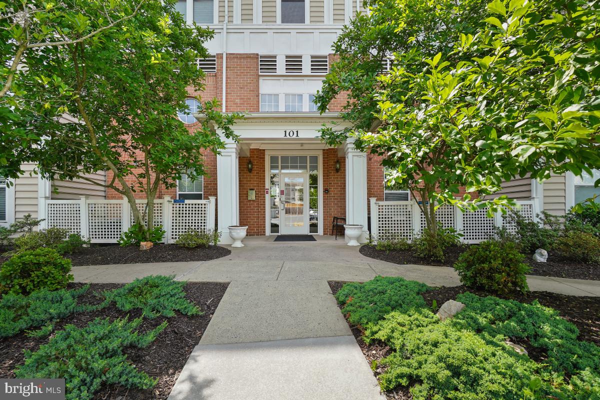 Welcome to 101 Watkins Pond Blvd. Unit 103 in the highly desirable King Farm community! This beautifully updated ground-floor condominium offers over 1,100 square feet of living space with 2 bedrooms, 2 bathrooms, and detached garage parking. Prime location just minutes to Metro, transit options, I-270, and major commuter routes, while also being walkable to King Farm Village Center featuring grocery stores, shops, restaurants, and King Farm Park.

Residents enjoy an abundance of community amenities including a swimming pool, clubhouse, jogging and walking paths, Metro shuttle service, and more. Inside, the home features wood flooring throughout and an open-concept layout ideal for everyday living and entertaining. The spacious living room offers direct access to a private outdoor patio, while the formal dining area flows seamlessly into the eat-in kitchen complete with ample cabinetry, stainless steel appliances, granite countertops, and breakfast bar seating.

The large primary suite features a walk-in closet and private ensuite bathroom with oversized vanity and walk-in glass and tile shower. A spacious secondary bedroom provides convenient access to the full hallway bathroom. Additional highlights include full-size in-unit washer and dryer and ample storage throughout. The unit includes 1 garage parking space 1 owner garage parking space and 1 owner assigned parking and 3 guest parking spaces. 

Schedule a showing today!