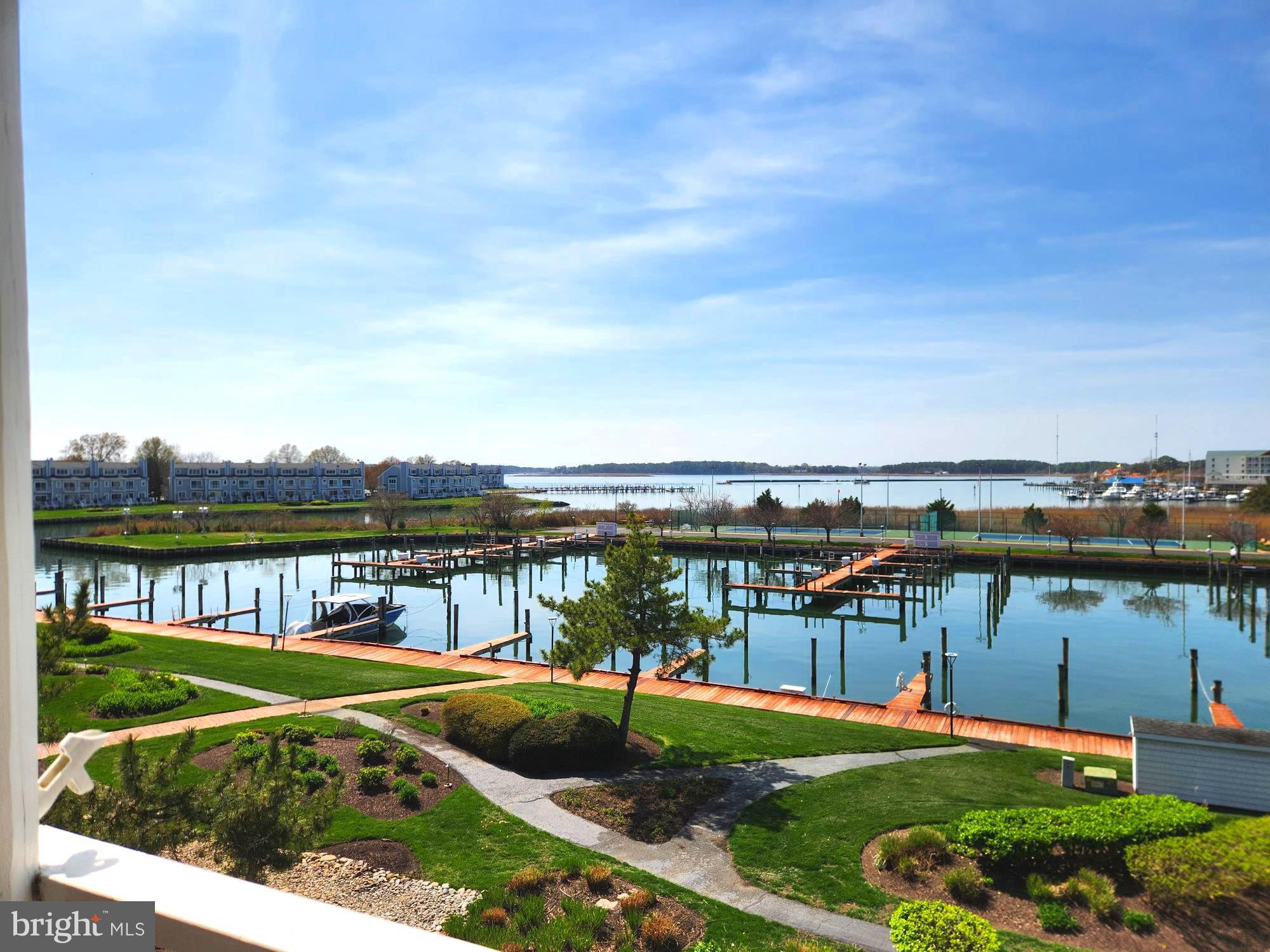 Nestled within the prestigious Oyster Cove community, this exquisite 3rd floor Penthouse corner residence offers a harmonious blend of luxury and comfort, perfectly situated along the serene  Kent Narrows/ Prospect bay.  Served by elevator, the contemporary architectural style is complemented by high-end finishes throughout, including luxury vinyl plank flooring and elegant built-ins that enhance the open floor plan. Step inside to discover a spacious family room that seamlessly connects to a gourmet kitchen, featuring upgraded countertops and modern appliances, including a sleek electric range and a convenient dishwasher. The inviting breakfast area is perfect for casual dining, while the primary bath offers a private retreat with sophisticated fixtures. Enjoy the tranquility of river views from your porch, where you can unwind and soak in the picturesque surroundings. The property boasts deeded private 40 foot boat slip, ideal for boating enthusiasts, and a community pool for leisurely afternoons. Additional amenities include a gated entrance, ensuring privacy and security, along with beautifully maintained common grounds and walking paths. With three generously sized bedrooms and a cozy electric fireplace, this home is designed for both relaxation and entertaining. The community offers a wealth of recreational options, including tennis courts, pickle ball and picnic areas, enhancing the luxurious lifestyle that Oyster Cove provides. Experience the ultimate in waterfront living, where every detail has been thoughtfully curated for your enjoyment.