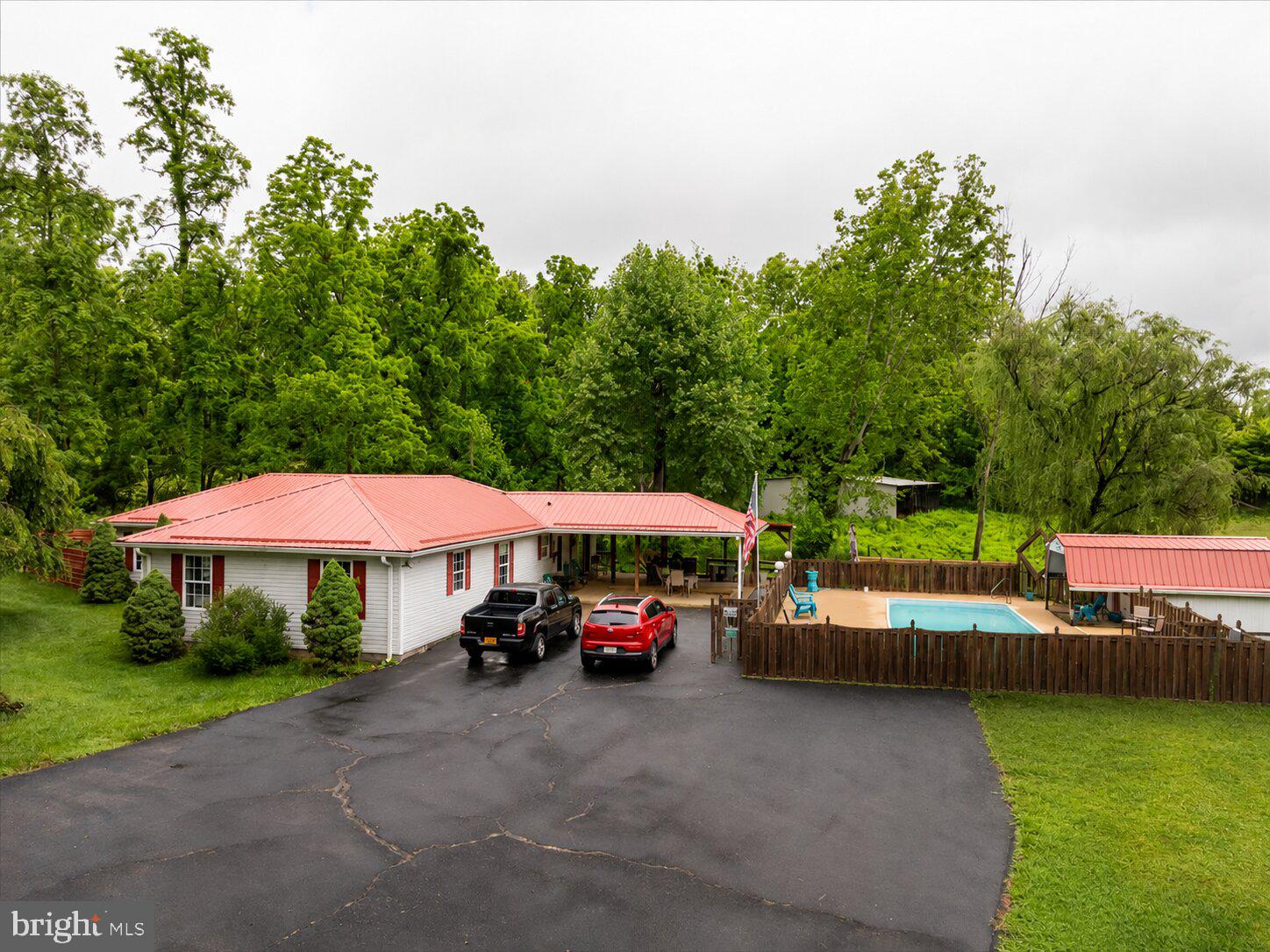 Welcome to 11419 Oak Grove Rd, the perfect blend of country charm, functionality, and outdoor living on approximately 2 beautiful acres in Bristol, VA. This spacious 4-bedroom ranch-style home offers one-level living with room to spread out both inside and out.

Step outside and enjoy your own private retreat featuring an in-ground pool, pool house, multiple entertaining areas, and scenic pasture views. The property is fully equipped for hobby farming, storage, or workshop space with a barn, chicken coop, rabbit hutch, and three outdoor sheds.

Major updates provide peace of mind including a new roof in 2019, new gutters in 2023, HVAC replaced in 2025, and gas hot water heater installed in 2023.

Whether you are looking for a mini farm, homestead potential, space for outdoor hobbies, or simply a peaceful property with incredible amenities, this home offers endless possibilities for its next owner. Conveniently located while still offering privacy and a true country setting, this rare Bristol property is one you do not want to miss.
