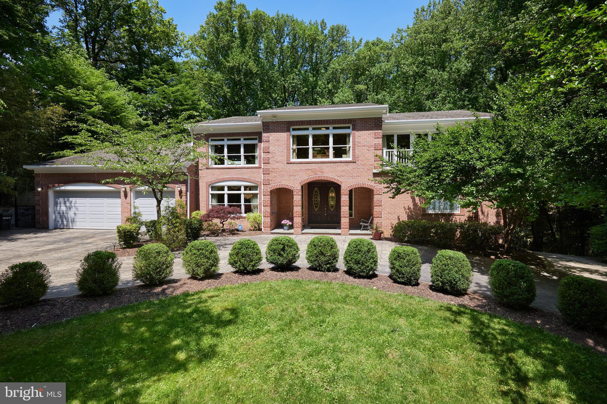 Welcome to luxury living with this 9,800 square foot contemporary masterpiece nestled on a private one-acre lot in Congressional Country Club Estates. Meticulously renovated with over $900,000 in custom upgrades, this eight-bedroom, nine-bath estate is designed for elegant entertaining and comfortable family living.
Upon entry, guests are greeted through French double doors into a grand two-story foyer adorned with a stunning crystal chandelier and marble floors. The first-floor owner's suite boasts a private office, three walk-in closets, and an opulent ensuite bath, complete with a floor-to-ceiling brick fireplace and private deck.
Entertain with ease in the two-story family room, which features a loft, skylights, and a separate butler's pantry. Adjacently, there is a gourmet kitchen equipped with professional stainless-steel appliances, granite counters, and custom cherry-wood cabinets. The kitchen overlooks a sun-filled breakfast room with panoramic views of the recently added pool and spa. 
On the second level, discover a second loft and five additional spacious bedrooms with updated ensuite Jack-and-Jill bathrooms. The walk-out basement offers 9-foot ceilings throughout, a recreation room with a wet bar, a theater room, and a tasting room with a wine bar and cellar. The in-law suite features private amenities for extended family or guests, including a living room, a kitchen, an additional bedroom, and a full bath with laundry.
Enjoy al fresco dining on the expansive outdoor deck or relax on the lower-level patio with the new spa and pool steps away. Conveniently located near Potomac Village, downtown Bethesda, and public transportation, seize this unparalleled opportunity for sumptuous living.