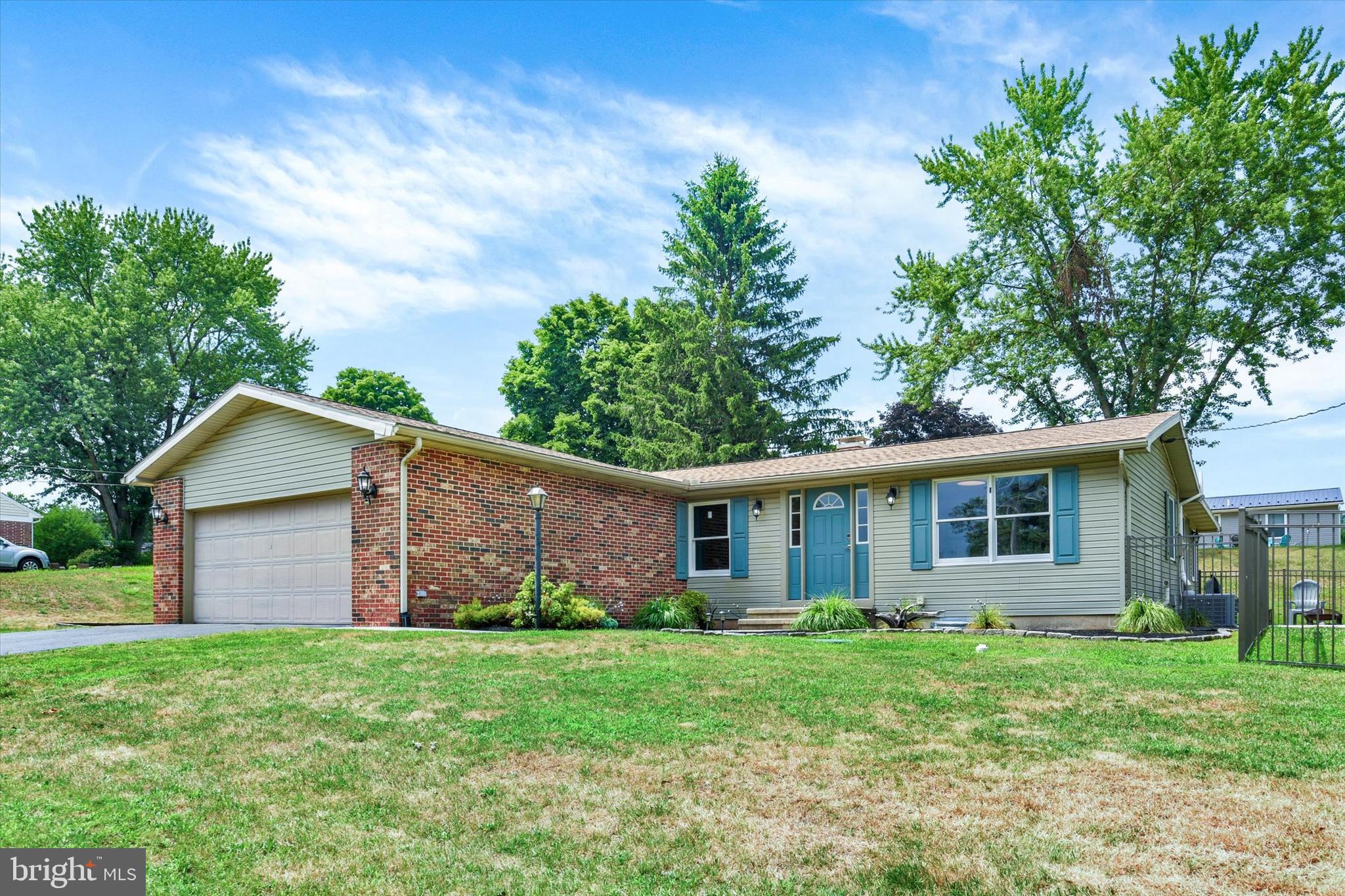 Welcome home to this turnkey rancher offering beautiful mountain views while remaining just minutes from Harrisburg and all its conveniences! Step inside to durable luxury vinyl plank flooring that flows into the bright, open-concept living room, where large windows fill the space with natural light and showcase the scenic surroundings. The well-appointed kitchen features stainless steel stove, microwave and dishwasher, butcher block countertops, and a stylish tile backsplash. Enjoy everyday meals in the adjoining dining room or unwind in the connected three-season room overlooking the backyard. The spacious primary bedroom includes a convenient private half bath, while two additional bedrooms and a full updated hall bath complete the main level. Downstairs, you'll find even more living space with a large family room highlighted by a beautiful stone gas fireplace, the ideal spot for cold winter nights. An inviting bar area is a bonus and perfect for entertaining guests. Step outside to take in the stunning mountain views from the patio or enjoy gatherings on the deck. A newly installed fence adds privacy and peace of mind, making the backyard an ideal place to relax, entertain, or simply hang out with your furry friends. This home is truly turnkey with the following recent updates: New roof (2025), water heater (2021), gas HVAC system (2022), fence (2026). Nothing to do here but move in!