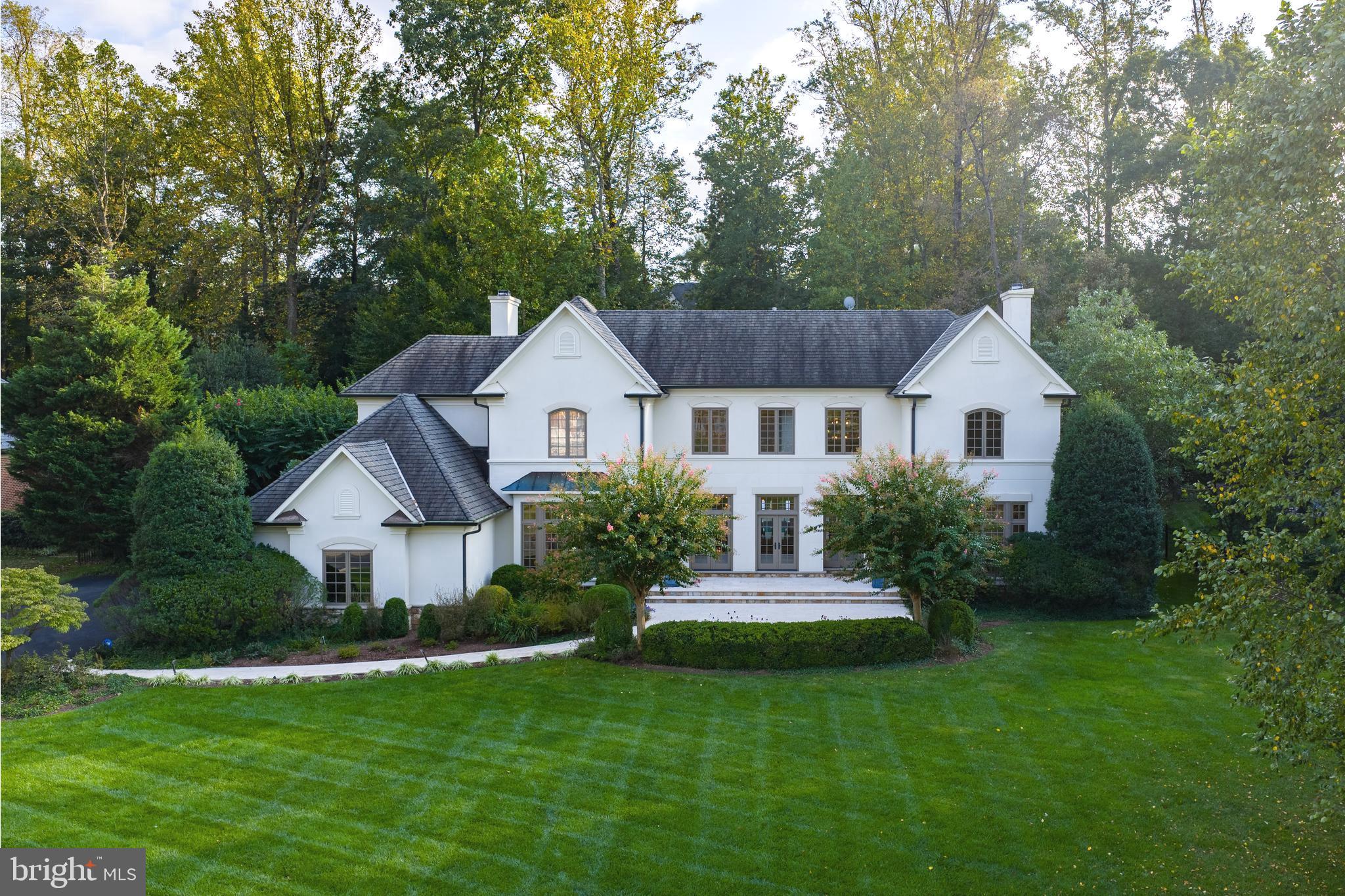 **Offer Deadline: Tuesday 9/30 by 5PM ** Welcome home to Glenhaven, a stunning residence nestled on a secluded cul-de-sac in The Reserve, one of McLean’s most desirable neighborhoods. Experience timeless elegance in this French country–style home, where classic charm meets modern comfort. A series of French doors grace both the front and back of the property, creating a seamless indoor-outdoor flow and filling the home with natural light.

With nearly 8,000 finished square feet, this home is perfect for entertaining. The open design, enhanced by oversized windows and doors allows gatherings to move effortlessly from inside to the expansive outdoor spaces. Whether hosting guests around the pool and outdoor kitchen, or enjoying a quiet evening with the doors open to invite in fresh air, this home is designed for comfort, connection, and style.

On the main level, the grand two-story foyer is flanked by the dining room and formal sitting room, while a private office is tucked away at the front of the house next to the first of two powder rooms on the main floor. The beautifully updated kitchen overlooks the family room, creating a bright and welcoming hub for daily living. The nearby mudroom includes custom cabinetry with great storage, and is adjacent to the side loading three-car garage and second powder room.

Upstairs, the oversized primary suite offers a luxurious retreat with a renovated bathroom, dual walk-in closets, and a serene atmosphere. The laundry room is also conveniently located outside the primary near the second back staircase. Three additional ensuite bedrooms complete the upper level, each offering comfort and privacy. 

The fully finished lower level features brand-new flooring and multiple spaces for entertaining. A stylish wet bar anchors the recreation area, while a flexible room can easily serve as a home gym or media room. A private bedroom with an adjacent full bath makes this level ideal for guests or extended stays.

Outdoors, a gracious veranda with striking arches overlooks the pool and wonderfully landscaped backyard. Thoughtfully designed for both relaxation and entertaining, the backyard is a true extension of the living space.

Situated close to top-rated schools, parks, and shopping centers, this home offers unparalleled convenience while providing a private sanctuary the moment you return.