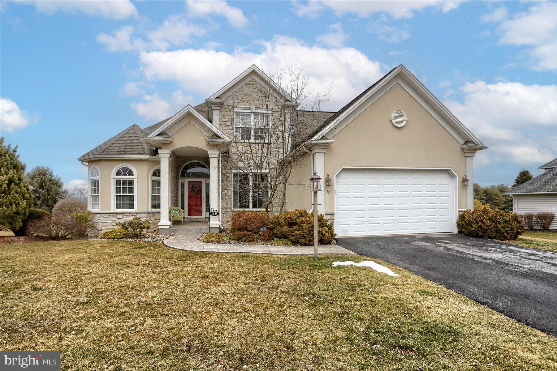 Exquisite contemporary 2-story home in Mayapple Village is graciously awaiting it's next owner!  And...the green of Hole 6 of Mayapple Golf Course is visible from the picture windows that adorn the home's Great Room.  Enjoy tons of natural light which comes into this home.  If it's an open floor plan that you are seeking, this home has this and much, much more.  Attractive blinds and window treatments remain to save you on that additional expense.  The main level carpets were replaced in 11/2022, and the HVAC (gas furnace and Central Air handler) are newer, as well.  The home boasts a main level owner's suite with attached private bath with 2 separate sinks and a shower and a whirlpool tub.  A walk-in closet and an additional closet are located at the walkway to this luxurious bathroom.  This main level has a room that could have multiple uses.  Currently, it is being used as an office, but could be used as an additional guest bedroom, a library or a formal living room.  There is a full bath conveniently situated just outside of this room.  Upstairs you will discover 2 bedrooms (both with ceiling fans) and a full bath with a sunlight.  The 2nd level has an open hallway with an attractive wooden banister dramatically overlooking the Great Room below and view of it's majestic  floor-to-ceiling stone gas fireplace and the gourmet kitchen.  Do you enjoy cooking on a gas range?  Here you Go!  The double wall oven is electric, however.  ALL appliances in the kitchen remain, as do the washer and gas dryer on the main level laundry.  Enjoy a quick meal at the center kitchen island or in the breakfast nook area that opens out onto the lovely composite deck.  If formal dining is needed, there is that option, as well.  A large dining room table and chairs and other dining room furniture comfortably fits in the dining room.  This home is a DREAM if you need to entertain.  All you have to do is walk downstairs to the lower level bonus room to discover this fact.  The wet bar is tucked into the one corner leaving the rest of the room open for gaming tables of your choice, or set up several long tables for your party guests to enjoy a meal or refreshments.  Two other rooms are off the large bonus room.  One is currently being used as a media room or den.  Beside it is a 4th or 5th bedroom (if you use the main level office as a 4th bedroom).  This room is not heated or cooled, but the present owners are leaving the portable heating unit to cut down the chill of the cooler months in these rooms.  Worried that all of this finished area doesn't leave room for storage?  Don't be concerned...there is a large unfinished storage area beyond the den where the HVAC is installed as well as a functioning Radon Mitigation System, Sump Pit/Pump and grinder pump for the toilet in the Rec Room's 1/2 bath.  Then retreat to the outside - particularly the deck and patio area where you can enjoy the hot tub and outside dining...all awhile watching the golf plays take place on that 6th hole green.  This is a truly remarkable property - INSIDE AND OUT!  Schedule your showing now.