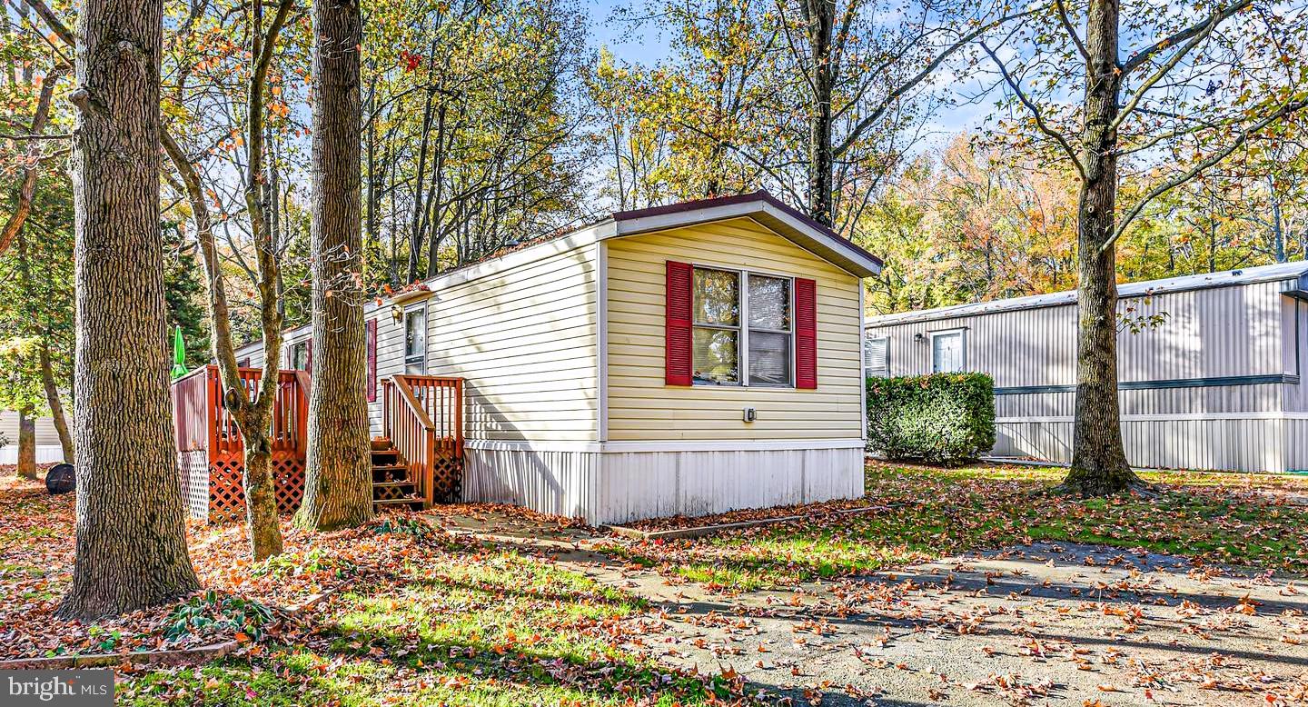 This home is very spacious ready for your touches—supersized deck.  Interior of this home offers you a lovely open floor plan, large rooms throughout. Split floor plan with primary bedroom and bathroom on one side and 2 bedrooms and a bath on the other side.  Spacious kitchen with breakfast bar.  Affordable monthly land lease. HVAC system put in 2024.  Great location. And  unbelieveable price.