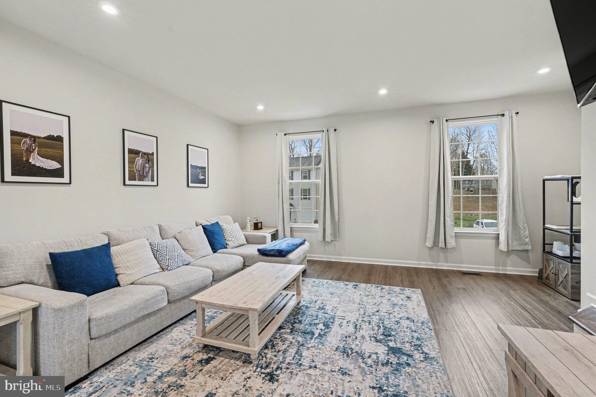 Built in 2023 and meticulously maintained, this well-appointed townhome offers modern finishes, flexible living space, and convenient access to everyday amenities. The entry level features interior access to the garage and a finished recreation room with a half bath, providing versatile space that may serve as a home office, sitting area, workout space, or additional living area depending on your needs.

The main level offers an open-concept layout designed for comfortable daily living and easy flow between spaces. The kitchen is equipped with 42-inch cabinetry with trim, recessed lighting, and upgraded luxury vinyl plank flooring, creating a clean and functional central gathering space. The adjoining dining and living areas provide an open setting suitable for a variety of furniture arrangements and uses.

Upstairs, the bedroom level includes three bedrooms and the convenience of an upper-level laundry area with washer and dryer included. The primary suite offers a spacious bedroom, ample closet space, and a private bath.

Outdoor features include a fully fenced rear yard and a large decorative concrete patio, offering additional usable space for outdoor seating, dining, or recreation.

Community amenities include a pool, clubhouse, walking trails, and tot lot. Conveniently located in Locust Grove, this home offers access to nearby shopping, dining, and commuter routes, with proximity to Culpeper, Fredericksburg, and I-95.

A great opportunity to own a nearly new home with modern finishes, flexible living areas, and community amenities.