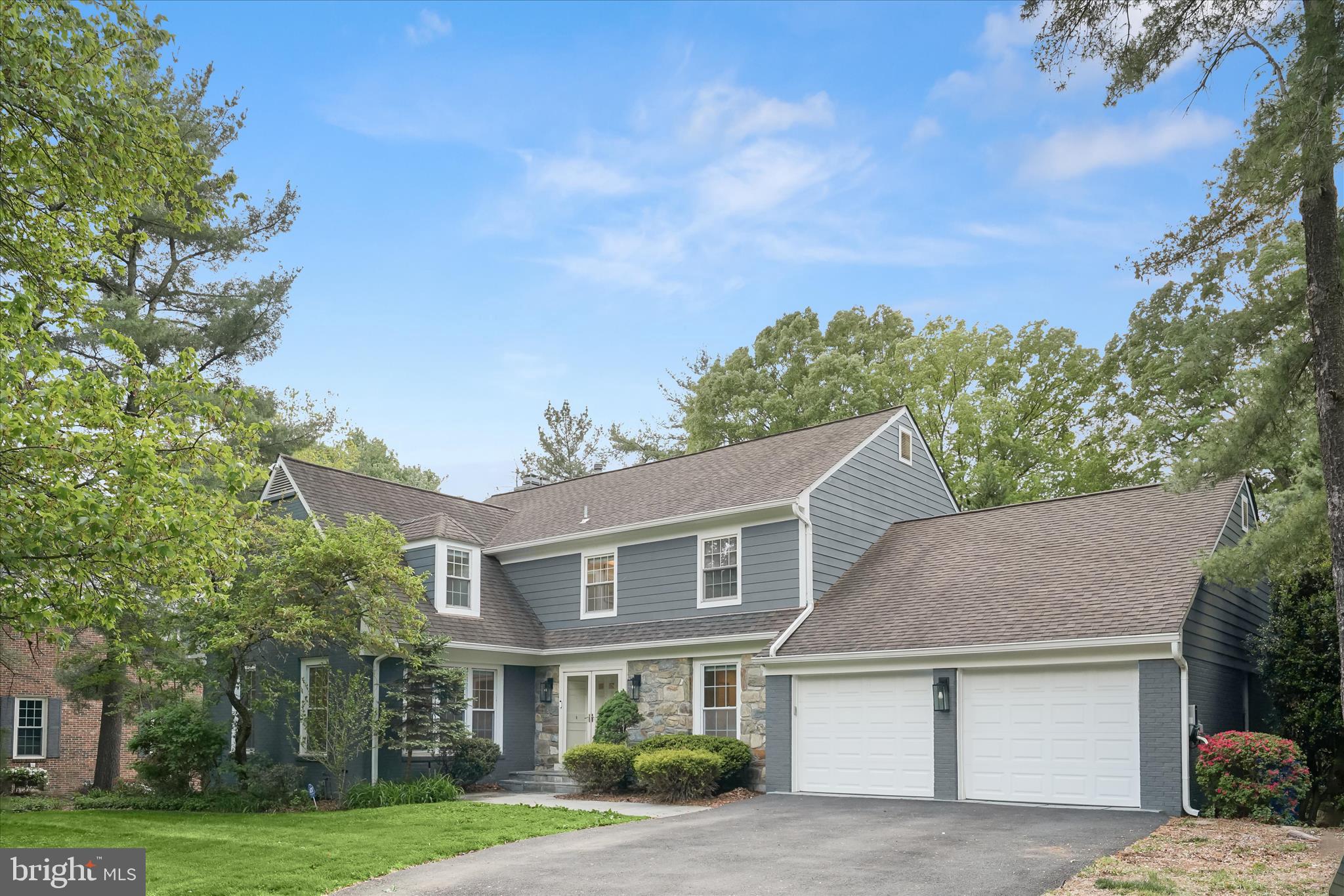 Tucked away in coveted Al Marah of Bethesda, this beautifully reimagined home offers thoughtful, modern updates in one of the area’s most sought-after locations. With effortless access to major commuter routes, top-rated public and private schools, and the best of downtown Bethesda, the setting is as exceptional as the home itself. From the moment you arrive, the inviting curb appeal and refined exterior hint at the elevated design found throughout.

Step through grand double doors into a spacious foyer that opens to the heart of the home: a stunning, sun-filled, and fully renovated kitchen designed for both everyday living and exceptional entertaining. Featuring an oversized Sub-Zero refrigerator and separate column freezer, a 48” Wolf eight-burner range with hood and double ovens, two sinks and two dishwashers, and a walk-in pantry, the space is as functional as it is beautiful. An oversized island offers generous seating and storage, while a sunlit breakfast area with a bay window overlooks the lush backyard. Just beyond, the home continues to impress with a seamless flow into the expansive family room, complete with a stylish built-in bar, a stone mantle, a wood-burning fireplace, recessed lighting, and access to the back deck. Tucked just off the main living space, the four-season sunroom offers a serene retreat with exposed brick, full heating and cooling, and a wall of glass doors that open to the deck, creating a perfect indoor-outdoor connection.

The main level also features a large formal dining room filled with natural light, ideal for both intimate dinners and larger gatherings. A versatile office or main-level bedroom with a closet and detailed molding adds flexibility, while a sleek powder room and multiple storage closets enhance everyday convenience. Beautiful hardwood floors and modern lighting are carried throughout, and a two-car garage completes this level.

Upstairs, hardwood floors continue, leading to a serene and spacious primary suite featuring recessed lighting, two walk-in closets, an additional bonus closet, and a beautifully renovated en-suite bath with a dual vanity, a soaking tub, a storage closet, and a stunning walk-in spa shower. A private secondary bedroom offers charming dormer windows, built-in seating, two closets, and its own updated en-suite bath. Two additional generously sized bedrooms share a renovated hall bath, complemented by two linen closets and a well-appointed upper-level laundry room with a utility sink and cabinetry.

The walkout lower level is designed with versatility in mind, ideal for entertaining, extended stays, or live-in accommodations. Featuring brand-new carpet, a second wood-burning fireplace with a stone mantle, and direct access to the backyard, the space also includes a full kitchenette with a gas range, full-size refrigerator, dishwasher, and ample storage. A bonus room provides the perfect home office or flex space, while a full bathroom and a fifth bedroom with abundant closet space and its own en-suite bathroom complete this level. 

Featuring five to six bedrooms, five-and-a-half baths, exceptional indoor-outdoor flow, and a spacious backyard with space to play or unwind, this home offers a rare combination of scale, style, and an unbeatable Bethesda location all in one!
