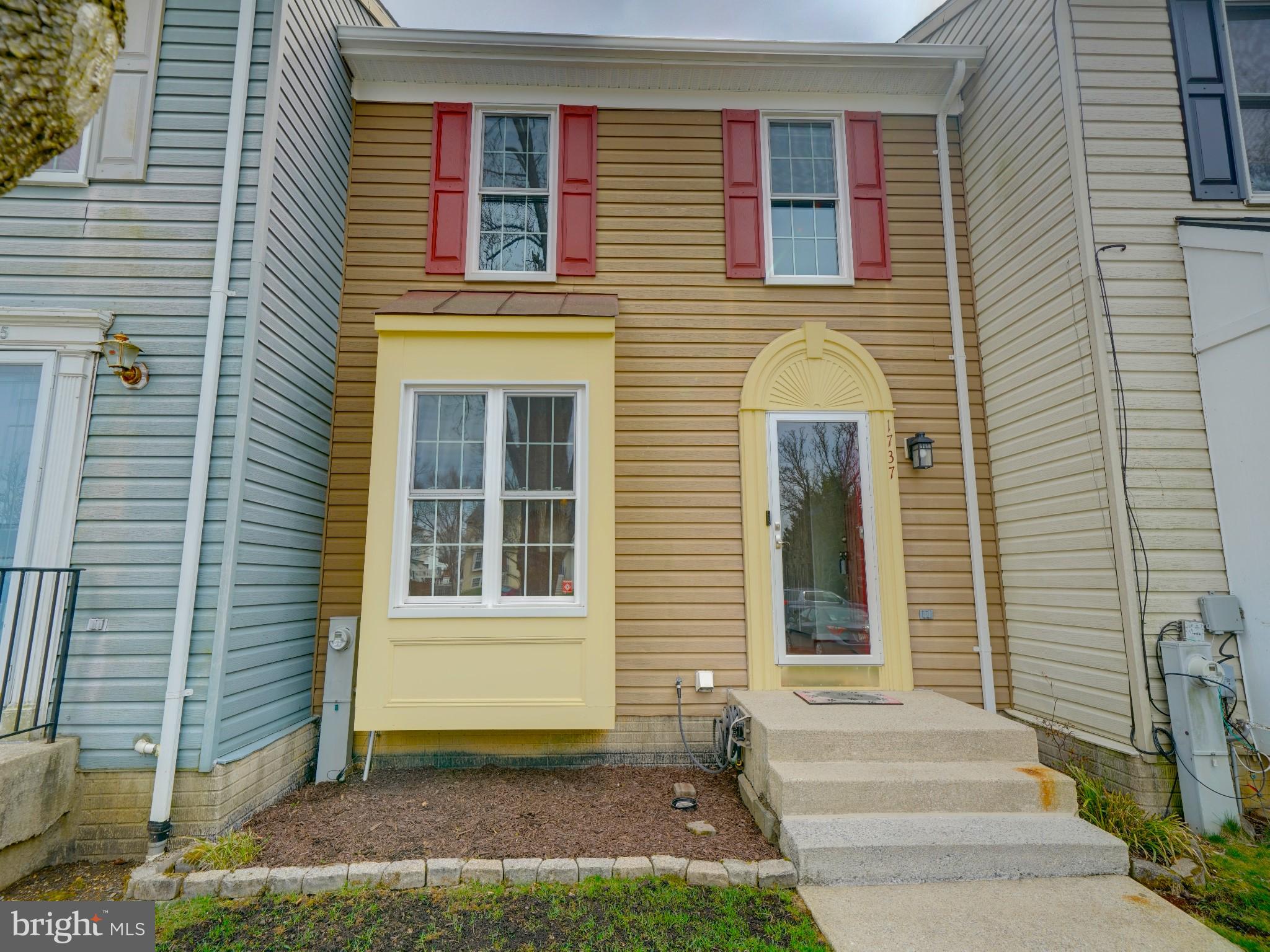 This charming, classic home offers a blend of comfort and convenience. The spacious foyer is a great landing zone. With 3 bedrooms and 2 full bathrooms, this home features a large kitchen, updated baths, and tons of storage. The primary bedrooms features a full en-suite and ample closet space. Bedrooms 2 and 3 are roomy and bright. The living room is freshly painted and adjoins the dining area. Step from the living room on to the huge deck and enjoy the wooded views. Back in the kitchen, there's modern appliances, upgraded counters and backsplash, with plenty of room for a table. The lower level offers space for movies, games, fitness, play--anything you need. It also features a walk-out to the covered patio. The laundry and utility room has space for a work bench and additional storage.  and 3  bedrooms one with attached bathroom. Parking is a breeze with two dedicated spaces. Experience the ease of townhouse living while being close to local amenities. Don’t miss the opportunity to make this delightful home yours!