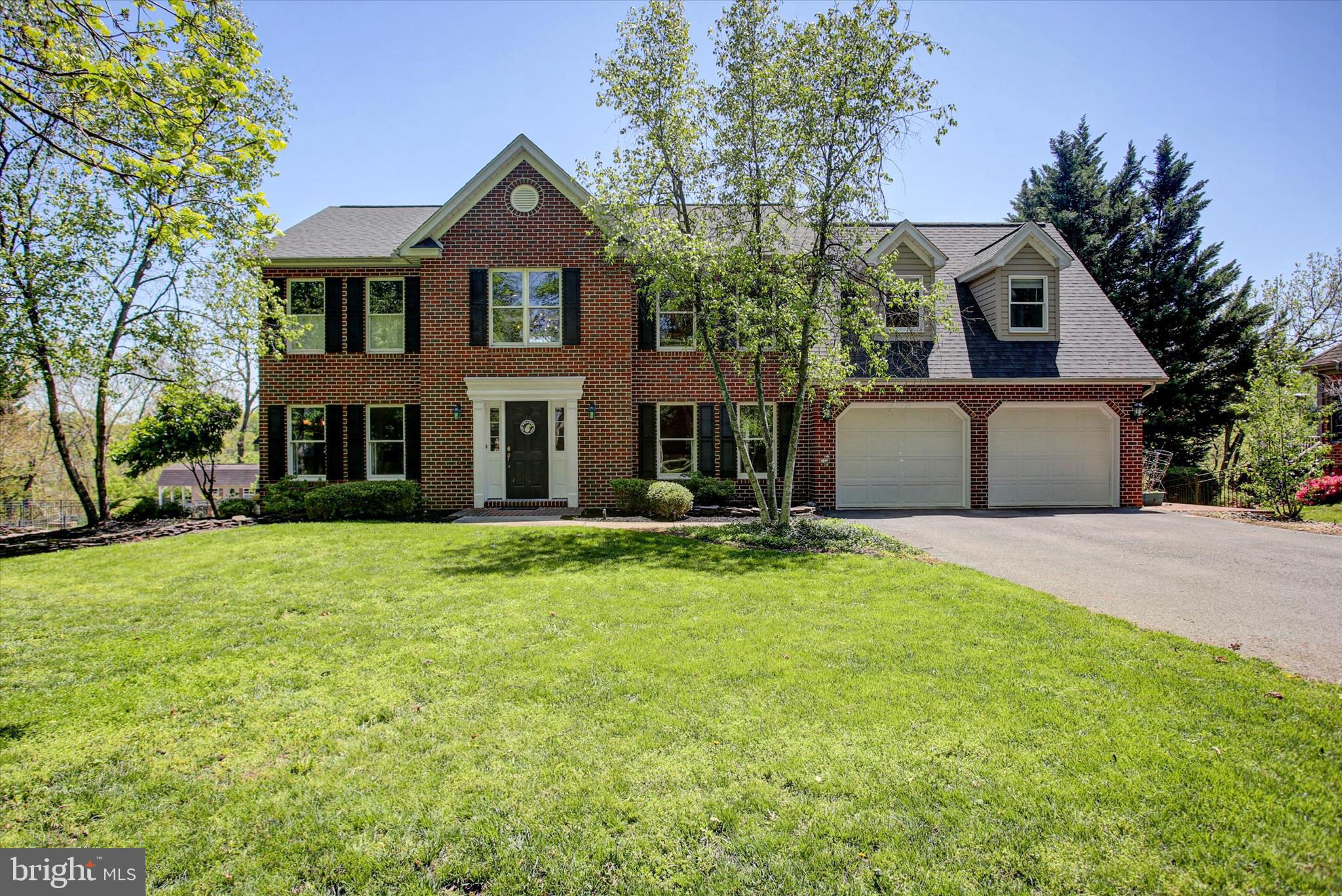 Now offered at a fresh new price - sellers are ready for the next chapter! 
Tucked within the highly sought‑after Greencastle Greens community, this custom‑built Colonial offers over 4,000 finished square feet designed for comfortable everyday living and effortless entertaining. The main level features soaring ceilings in the family room, a formal living area with a gas fireplace, a spacious dining room, and a beautifully crafted cherry kitchen. A private office with custom built‑ins overlooks the tranquil backyard - an ideal work‑from‑home setting. Off the kitchen and family room, a large covered deck extends the living space and leads to the backyard oasis.
Upstairs, the generous primary suite includes an updated tile and quartz bath and an impressive walk‑in dressing room with custom built‑ins and a center island. Three additional large bedrooms and a full bath with a walk‑in shower and soaking tub complete the upper level. The finished, walk‑out lower level adds even more living space with a theater room with fireplace, game room, and plenty of room for activities.
Outdoor living is exceptional on this 0.60‑acre property! Enjoy evenings in the custom outdoor kitchen - complete with built-in grill, fridge, ample seating, and an outdoor TV - or practice your putts on your private putting green. A path leads directly to Muddy Run Stream and offers views of the adjoining Greencastle Greens Golf Course. Mature trees, extensive landscaping in the front and backyards, and beautiful views throughout the property make this home truly stand out.
*Freshly sealed driveway on 5/30/26