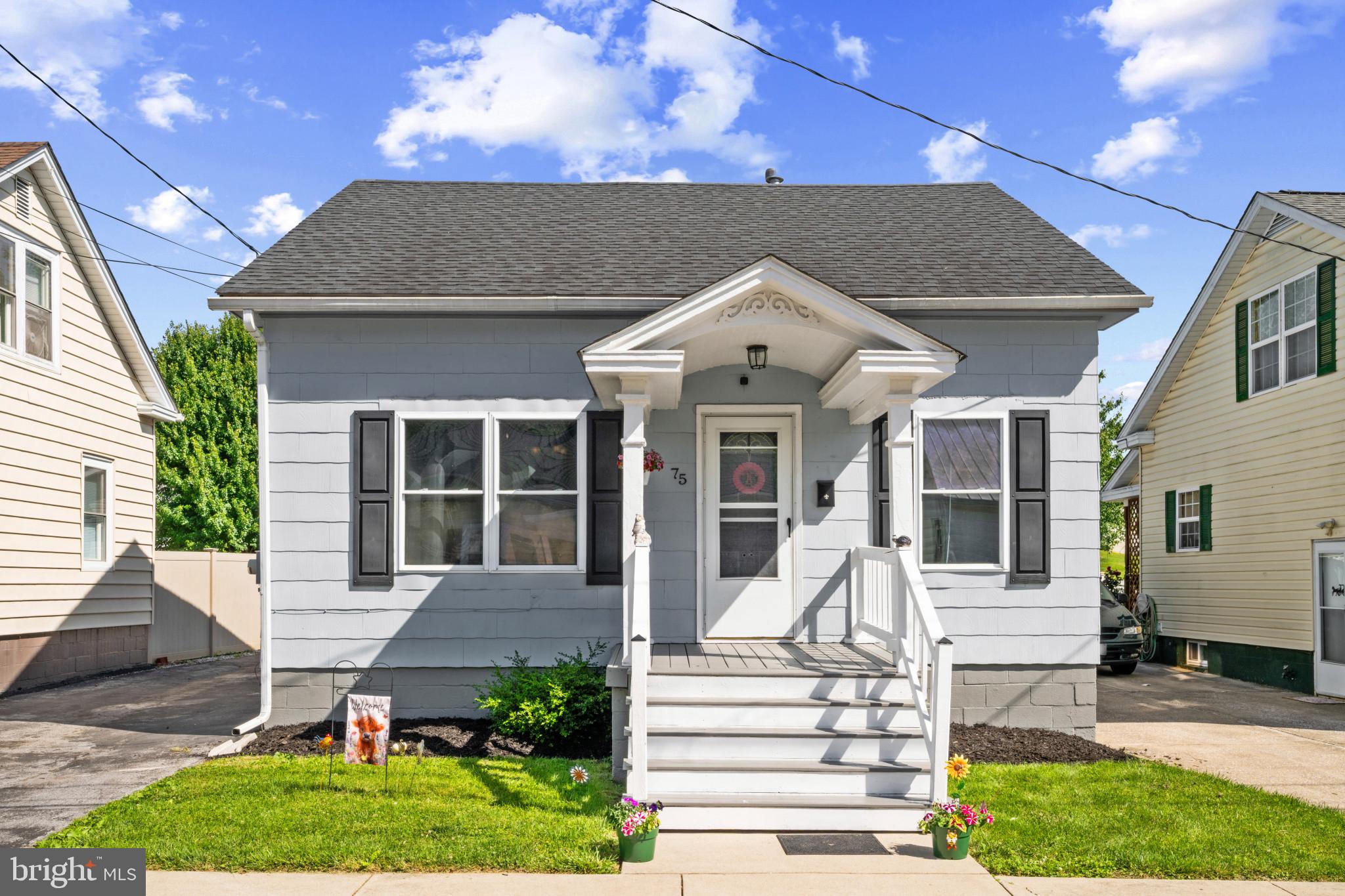 Cute & Spacious Cape Cod with Exceptional Parking & Garage Space!

This charming and spacious Cape Cod has been beautifully updated inside and out. Recent improvements include a renovated interior, fresh landscaping, exterior paint, and a roof replaced in 2021, creating outstanding curb appeal.

A standout feature of this property is the abundance of off-street parking and two detached garages. The first is a convenient 1-car garage located off the driveway, while the second offers two bays with oversized doors facing George Street, making it ideal for vehicles, equipment, hobbies, or workshop use.

Enjoy relaxing on the covered front and rear porches, or entertain guests on the large multi-level deck overlooking the backyard.

Inside, the kitchen features stainless steel appliances, abundant cabinet storage, and a large center island perfect for meal preparation and gathering. Hardwood floors throughout the main level and carpet throughout the upper level to add warmth and character to the home.

The main level includes a comfortable bedroom and a full bath, providing convenient one-level living options. Upstairs, you'll find two spacious bedrooms with skylights and generous closet space.

The fully finished lower level offers even more living space, including a large bonus room, full bath, laundry room, and dedicated storage area.

This move-in-ready home combines classic charm, modern updates, and exceptional garage and parking amenities that are hard to find.