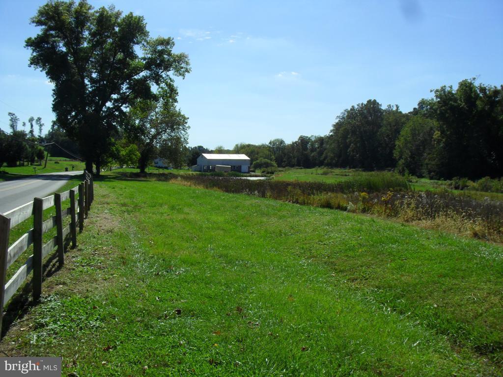 A picturesque valley in Providence of meadows, stream & ponds. Eighteen acres zoned agricultural that include a subdivided lot as well. The original ''Fish Hatchery'' has many possibilities.