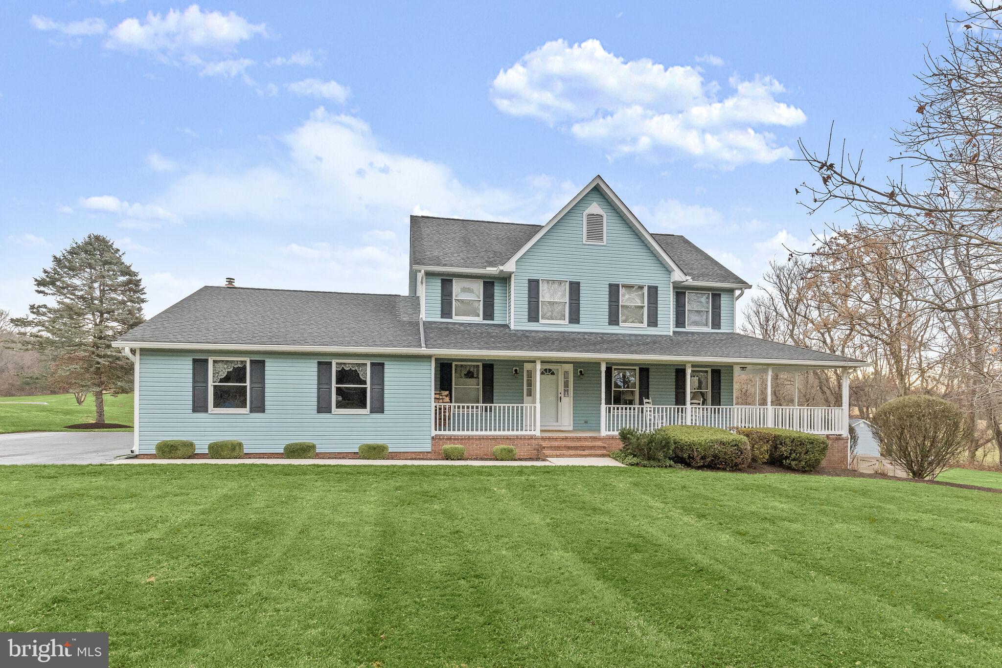 Discover the perfect blend of style and comfort in this captivating residence set on 3 acres of beautifully landscaped grounds.  The large sunroom welcomes you with accent wood walls and a high vaulted wood ceiling adorned with skylights, creating a bright and airy inviting space. The updated kitchen is a chef’s delight, featuring Silestone countertops, Italian porcelain flooring, a breakfast area, and a new smart oven, refrigerator, and dishwasher. A brick accent wall framing a wood burning stove becomes the focal point of the off-kitchen family room offering new carpet.  Formal living and dining rooms provide an ideal setting for entertaining guests or enjoying family gatherings.  Retreat to the primary bedroom with an en suite bathroom, where luxury awaits with a jetted, soaking tub, separate shower, and dual vanity.  Three additional bedrooms and a hall bath complete this level.  The finished lower level provides a recreation room with new LVP flooring, access to the yard,  and abundant storage space, providing additional living space and versatility. Outside, a wraparound porch invites you to relax and take in the scenic views and you can gather around the firepit for cozy evenings.  Plenty of parking on the long, turnaround driveway and 2 car garage, plus 2 storage sheds for your convenience.  Additional updates include the water heater, paint, gutters with leaf guards, office windows glass, front storm door, and more!  This property is a true haven.