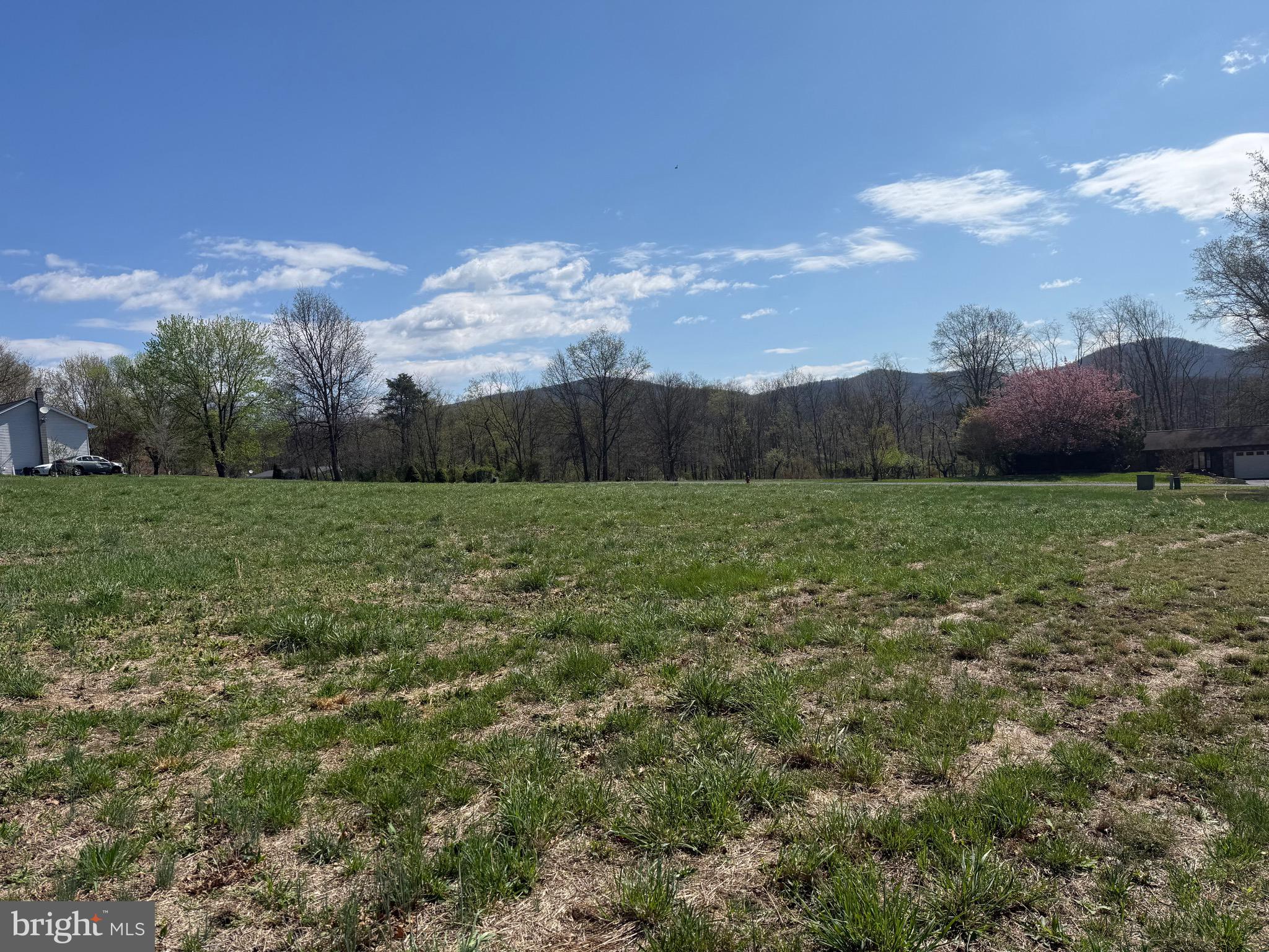 Imagine adding your dream home to this beautiful, cleared 1.1+/- acre lot. Equipped with electric and the availability of public water/sewer. This lot is ready for your new build! With easy access, backing to a nice tree-line and views of the beautiful mountains, what more could you want? Check it out today!