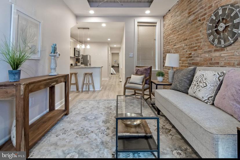 Welcome to 343 Scott Street. This Beautiful , Fully Leased Duplex boasts a 6+% Cap Rate! 4 Stories of Modern Finishes and High end appliances mix with Historic exposed brick and Period Details of this historic corner lot property. Both units are on annual leases and have 2 levels of living each. Walk out the front door and you are just steps to the UMAB Grad Campus shuttle,  a block from the Historic Pigtown Main street shops and only a few blocks from the UMAB Campus, Stadiums, Inner Harbor, Downtown and the up and coming Casino Entertainment District.  This distinct property has Parking for at least two cars and a connected lot that is currently a beautiful yard and garden but could be additional parking or room for expansion of the building. The South Facing Facade has one of Pigtown's few Residential Murals. Monthly income currently is $3400 plus 100$ in water reimbursement. 24 hour notice minimum for showings.