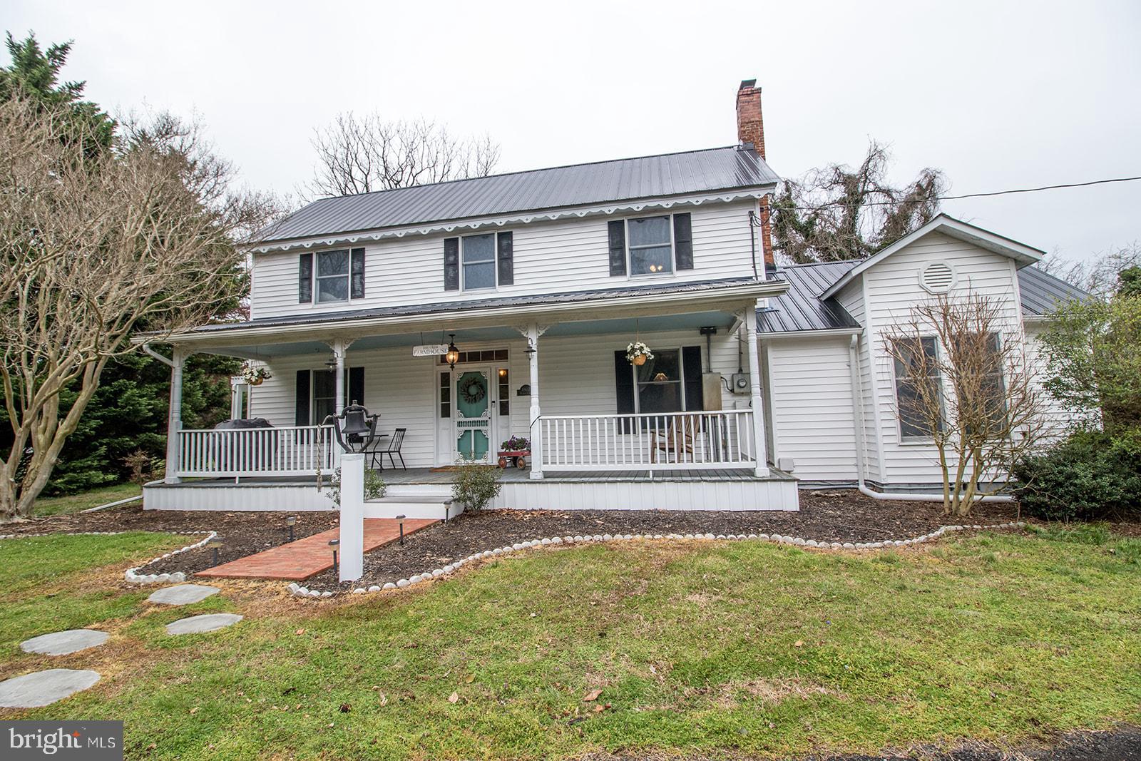 Welcome home to "The Olde Farmhouse"--wonderfully  restored, 4 bd, 2.5 bath authentic farmhouse -Not a cookie cutter, and so full of character and charm —features  tin ceiling/walls, exposed brick, original early 1900s wood flooring, original wood gingerbread trim at the roofline, plus magnolia trees lining the driveway -recently remodeled to bring out lots of original charm— with a few modern touches including, all new stainless steel appliances, spacious kitchen with farmhouse sink, bathrooms completely renovated with new plumbing, original hardwoods upstairs refinished, recently installed mini split heating and air units on the main floor, central air upstairs, hardwood floors throughout, large walk in closet off the master bedroom -new metal roof, huge yard of 2.4 acres with room on lot to build a garage , 1,000 square foot original shed with new metal roof and lean to, tucked into a quiet neighborhood but secluded by trees for privacy, screened in porch, large front porch, fenced in backyard with large concrete patio.