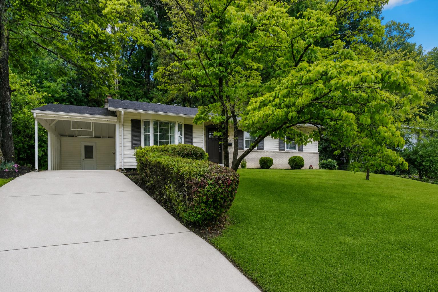This beautifully renovated, bright and spacious single-family home at 14419 Bauer Dr in the highly sought-after Manor Woods offers the perfect blend of modern updates and timeless appeal. The main level welcomes you with a gorgeous foyer featuring elegant 12x24 tile flooring that flows into a stunning renovated kitchen complete with modern gray cabinets, subway tile backsplash, granite counters, stainless steel appliances, and a large pantry. The main level boasts beautiful hardwood floors throughout. The kitchen opens seamlessly to a sunlit breakfast area and an expansive open-concept living and dining space, creating an ideal layout for both everyday living and entertaining. The dining room boasts sliding glass doors leading to a private, tree-lined backyard that backs to serene woods, providing a peaceful outdoor retreat on this generous 0.3-acre lot.
The main level also includes a primary suite with dual closets and a fully renovated ensuite bathroom, plus two additional generously sized bedrooms served by a beautifully updated hall full bath. Downstairs, the lower level features a versatile recreation room with a cozy wood-burning fireplace, perfect for gatherings and entertaining, along with a renovated full bath, ample storage, and a large, functional laundry area. Recent upgrades include brand new kitchen in 2025, brand new owner's bath in 2025, hardwood floors refinished in 2025, new water heater installed in 2026, and a complete roof and siding replacement in 2014, ensuring move-in readiness and peace of mind.
Located directly across from the Manor Woods Swim Club (with its community pool and activities), this home sits in a mature, tree-filled neighborhood known for its friendly community vibe. It is just minutes from Rockville Town Square, a vibrant downtown hub featuring a wide array of dining options, boutique shops, bars, a movie theater, the Rockville Library, seasonal outdoor concerts, events, a fountain plaza, and even a winter ice skating rink. Residents also enjoy quick access to Aspen Hill Shopping Center, schools, parks, and major highways, making this a highly convenient and desirable Rockville location. Note: Estimated tax shown is incorrect. Correct estimated taxes should be approximately  $6K per year at current assessment.