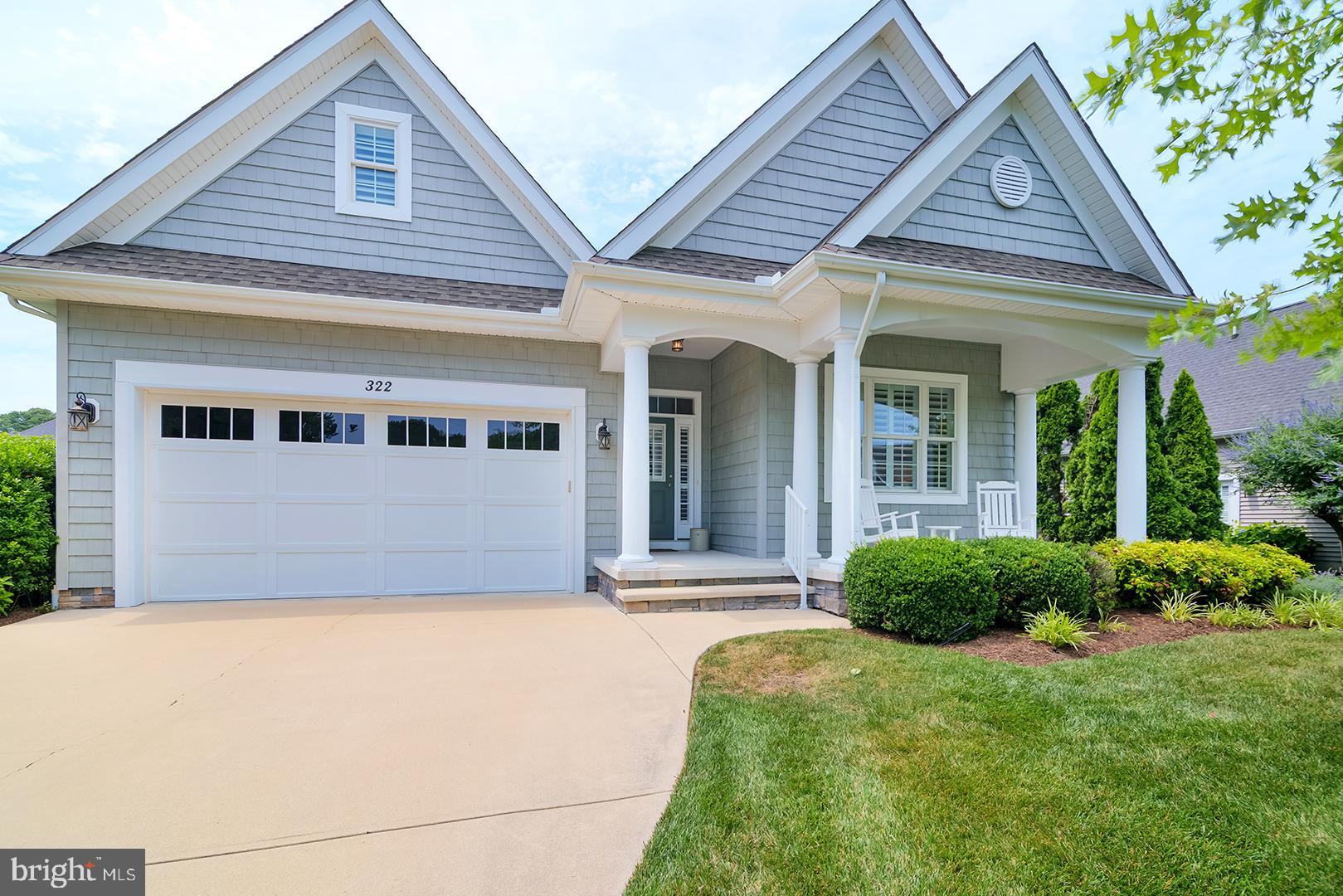 Walk to charming downtown Lewes from this beautifully designed home in the desirable Reserve at Pilottown Village. Built by Garrison Homes, this coastal-inspired residence offers the ease of single-level living with 3 bedrooms, 2 bathrooms, an open-concept floor plan, and timeless hardwood and tile flooring throughout the main living areas. The gourmet kitchen is the heart of the home, featuring abundant cabinetry and counter space, a spacious center island with seating and pendant lighting, a pantry, and seamless flow into the living room. The inviting living area showcases a vaulted ceiling and cozy gas fireplace, while the adjacent dining area opens through sliding glass doors to a private screened porch—perfect for enjoying morning coffee or relaxing after a day at the beach. The spacious primary suite offers a walk-in closet, ceiling fan and double-door entry to the ensuite bath, complete with tile flooring, a step-in shower with built-in bench, vanity with extended dressing bench, and natural light from a large window. Two additional bedrooms provide comfortable accommodations for guests or a home office. Additional highlights include an unfinished space above the garage offering excellent storage potential, a welcoming covered front porch with a sitting area, and a private screened rear porch ideal for outdoor living. With low HOA fees and an unbeatable location just minutes from dining, shopping, boating, miles of Delaware beaches, the Rehoboth Beach outlets, entertainment, and everything that makes the Salt Life so appealing, this exceptional home combines coastal style, comfort, and convenience in one of Lewes' most sought-after communities.