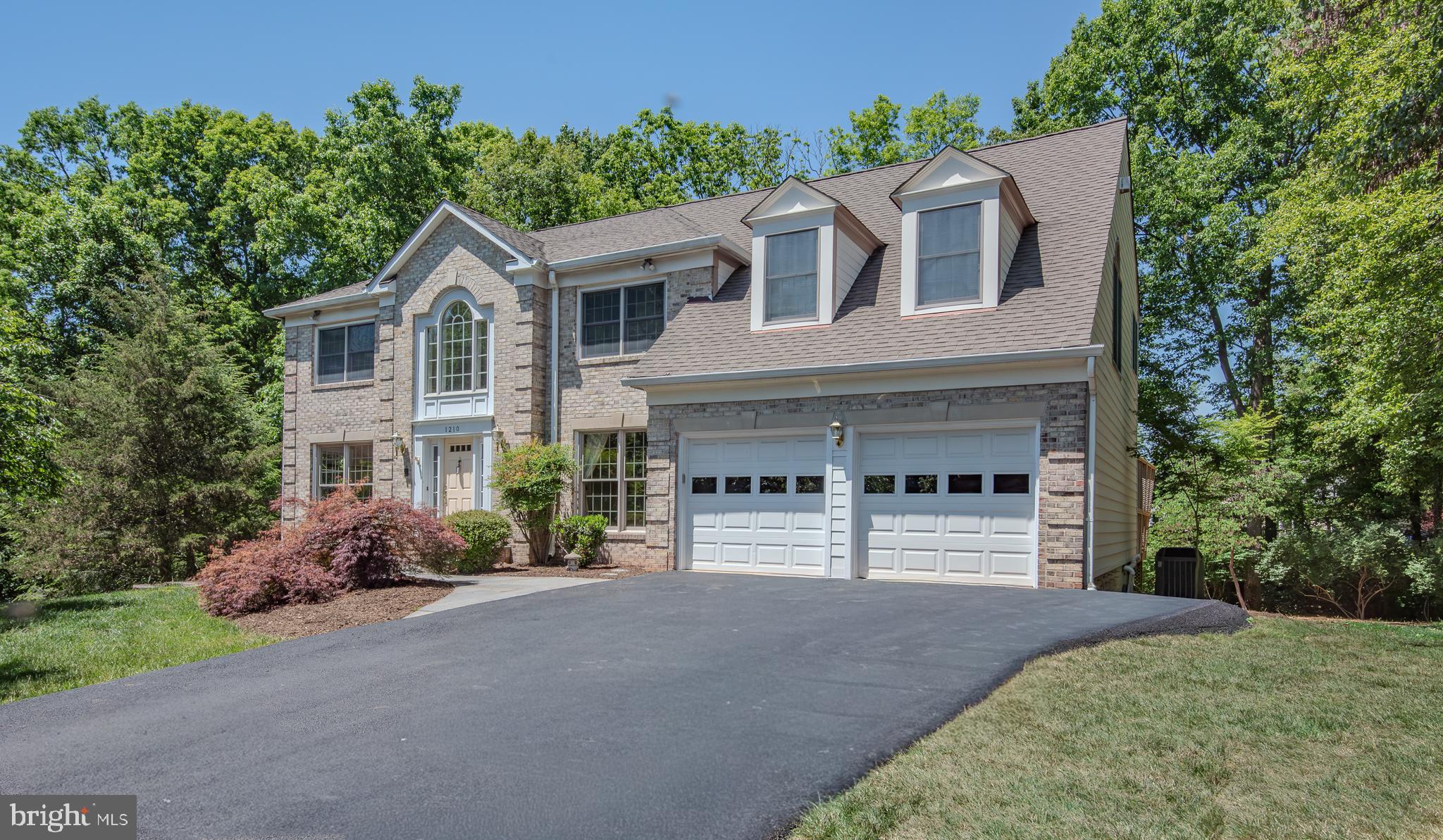 Beautiful 5 bedroom, 3 full bathroom, 1 half bath brick single family home in the sought after community of Shaker Woods. Large private lot nestled in a cul de sac with mature trees and plenty of outdoor space. Entering the home you will be greeted by a soaring two story foyer, with raised wainscoting paneling extending up to the second level and down the hallway. Coffered ceilings, plenty of natural light from the large windows create a warm and bright entry way. Spacious formal living room and dining room flank
the entry way. Stunning home office with french doors, custom built ins and a large bay window.
A two story family room with wood burning fireplace and enclosed deck off the back are perfect
for entertaining and family gatherings. Fresh sod in the back and side yard. Fantastic remodeled eat in kitchen (2025) featuring white shaker cabinets, quartz counter tops, tile backsplash, Kitchen Aide 36” cooktop with downdraft
venting, dual 30” convection wall ovens, stainless steel appliances and large storage pantry.
Custom laundry center with bench seating, storage cabinetry, granite counter tops and slate
flooring is conveniently located off of the 2 car garage. Solid hardwood flooring, recessed lights, half bath and many custom touches throughout the main level. Hardwood flooring continues upstairs where you’ll find 4 bedrooms, a hallway bath with frameless shower and marble vanity. Primary suite of your dreams with 2 large closets, a walk-in closet with custom closet system, dressing area with vanity, gas fireplace flanked by built in bookshelves and custom window seats. Recently remodeled (2025) spa like bathroom with oversized shower, free standing bathtub, dual vanities and heated floors. Walk out basement
with a large rec room, flex space with multiple closets, unfinished storage, 5th bedroom (legal)
and spa like full bathroom with heated floors, dressing area and large shower make for the
perfect lower level! This location cannot be beat as you are less than 10 minutes to Reston
Town Center, multiple shopping centers, parks and major commuter roads. Quick access to
Fairfax County Parkway, Route 7, Route 28, Wiehle Metro and the Dulles Toll Road.