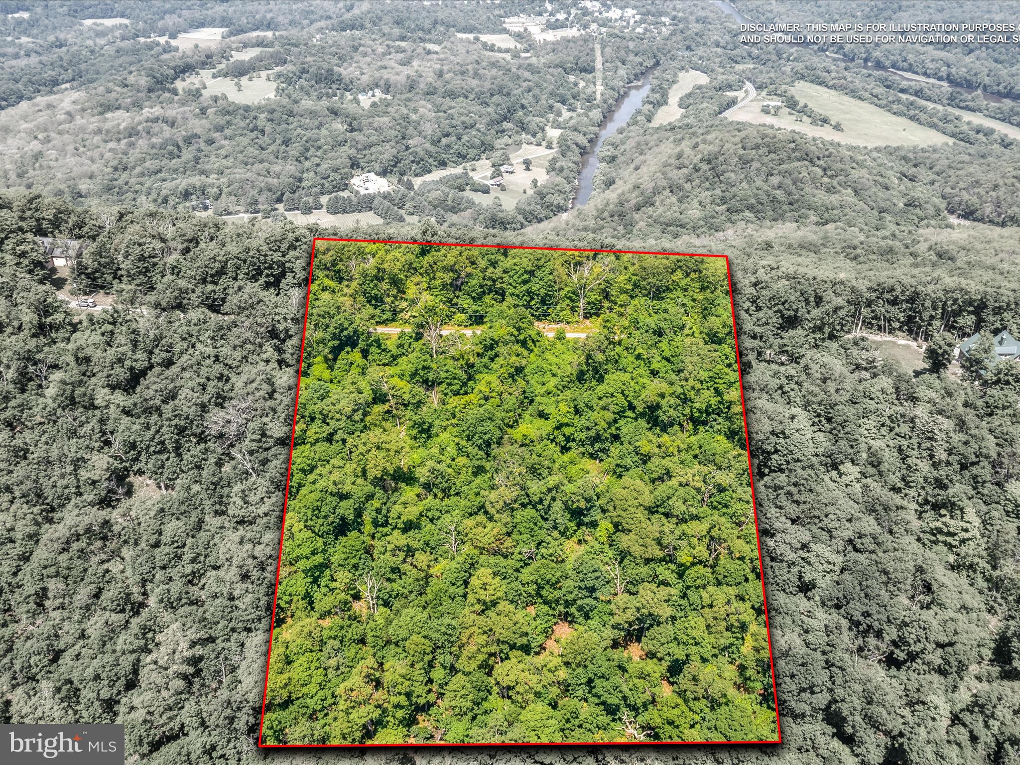 For those seeking privacy, security, and natural beauty, this 10 acre property within a gated community is an ideal choice.  Its hilltop position offers a potential panoramic view, complemented by the property's beautiful hardwood trees and natural stone.  Restrictions apply to protect the community's natural charm, and easy access makes this a perfect opportunity for a luxury home or investment.   NO AirB&B's or short term rentals allowed.
