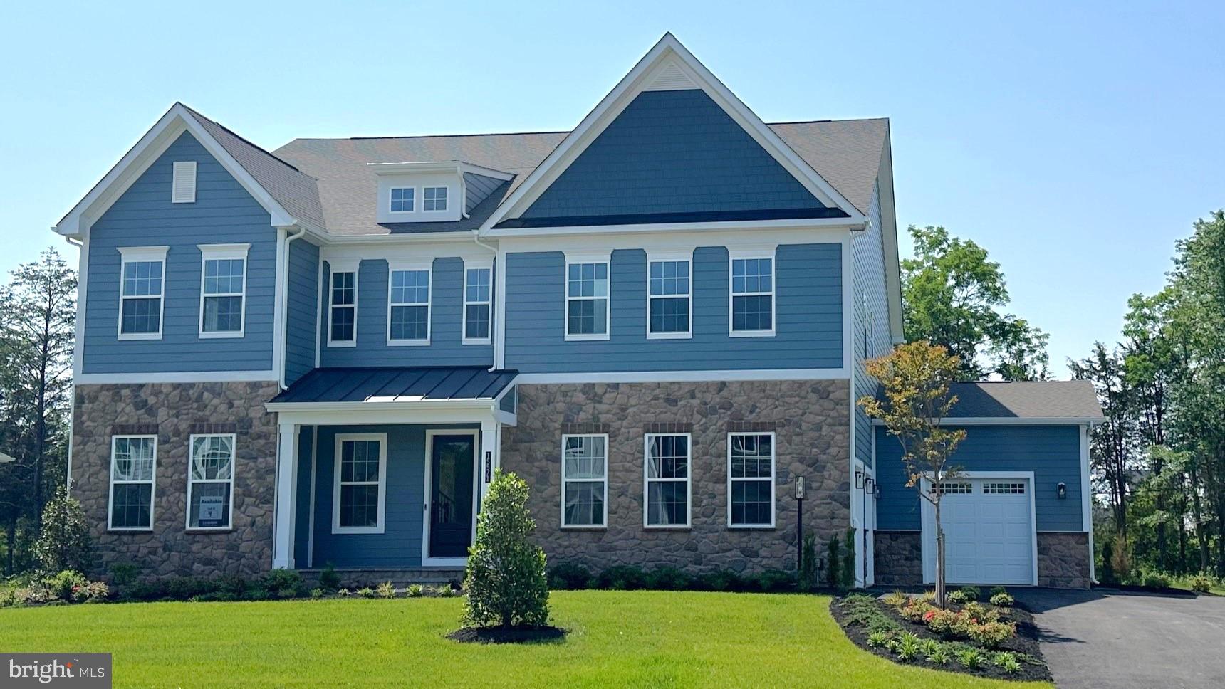 Move In Ready! Designed with an extensive grand 2-story foyer, this home plan warmly greets your guests. Complete with dining, foyer, great room, primary bedroom & primary bath tray ceilings, the formal dining and flex room lead you to a spacious beamed ceiling great room, kitchen and first floor bedroom with full bath. The owners entry features built in cabinets and a private entry to the main level bedroom with ensuite full bath. All bedrooms have their own private baths and walk in closets.  The expansive Primary suite has dual walk in closets, sitting area and primary grand bath including a free-standing tub and spa-like shower. This design offers a finished recreation room and the basement bedroom and full bath are complete for your convenience. 
Up to $10,000 total closing cost is tied to the use of DHI Mortgage.
*Photos, 3D tours, and videos are representative of plan only and may vary as built.*