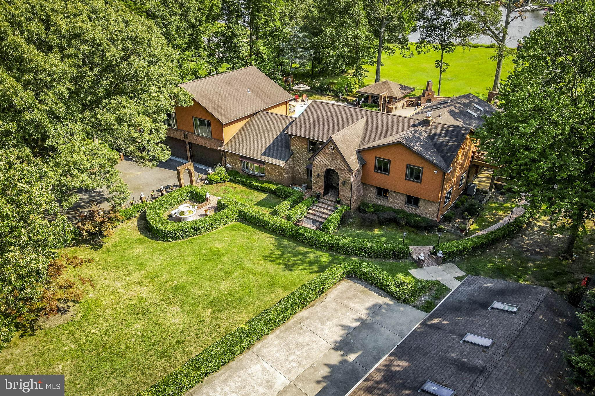 PRICE REDUCTION!!!!!!!!

Luxurious Waterfront Estate on the Bodkin Creek – Pasadena, MD

Step into unparalleled elegance with this magnificent waterfront estate, ideally located on the serene Bodkin Creek. This extraordinary property spans 2.37 acres and boasts over 300 feet of pristine river frontage, offering breathtaking views and exceptional amenities.

Key Features:

Expansive Living Quarters: The estate features 6 generously sized bedrooms and 5 bathrooms. The master suite is a true retreat, offering stunning creek views, a private balcony, and a spa-like en-suite bathroom with a soaking tub and walk-in shower.
Versatile Separate Apartment: This self-contained unit includes its own full kitchen, living area, and two large bedrooms, providing the perfect solution for multi-generational living, guest accommodation, or potential rental income.
Resort-Style Amenities: The property boasts a swimming pool with a sun deck, a relaxing sauna for unwinding after a long day, and a fully-equipped gym to maintain your fitness routine in privacy and comfort.
Exceptional Outdoor Living: The sprawling brick patio is ideal for entertaining, featuring ample space for dining and lounging while enjoying the picturesque river views. The gazebo, complete with an outdoor fireplace, offers a cozy setting for evening gatherings or quiet moments by the water.
Private Sandy Beach & Deep Water Pier: Enjoy your own sandy beach for sunbathing and water activities, as well as a deep water pier, perfect for docking boats and indulging in waterfront recreation.
Extensive Parking & Storage: The estate includes a 5-car detached garage and a 2-car attached garage, providing abundant space for vehicles, boats, and additional storage needs.
Picturesque Setting: Floor-to-ceiling windows throughout the home maximize natural light and showcase the spectacular creek views, seamlessly blending indoor and outdoor living spaces.
Additional Features: The property is meticulously maintained and includes
modern appliances and energy-efficient systems, ensuring a luxurious and comfortable lifestyle.
This rare estate offers a unique combination of luxury, privacy, and natural beauty. Don’t miss the opportunity to own this unparalleled property. Contact us today to schedule your private tour and experience the extraordinary lifestyle this home has to offer. Home does not require flood insurance