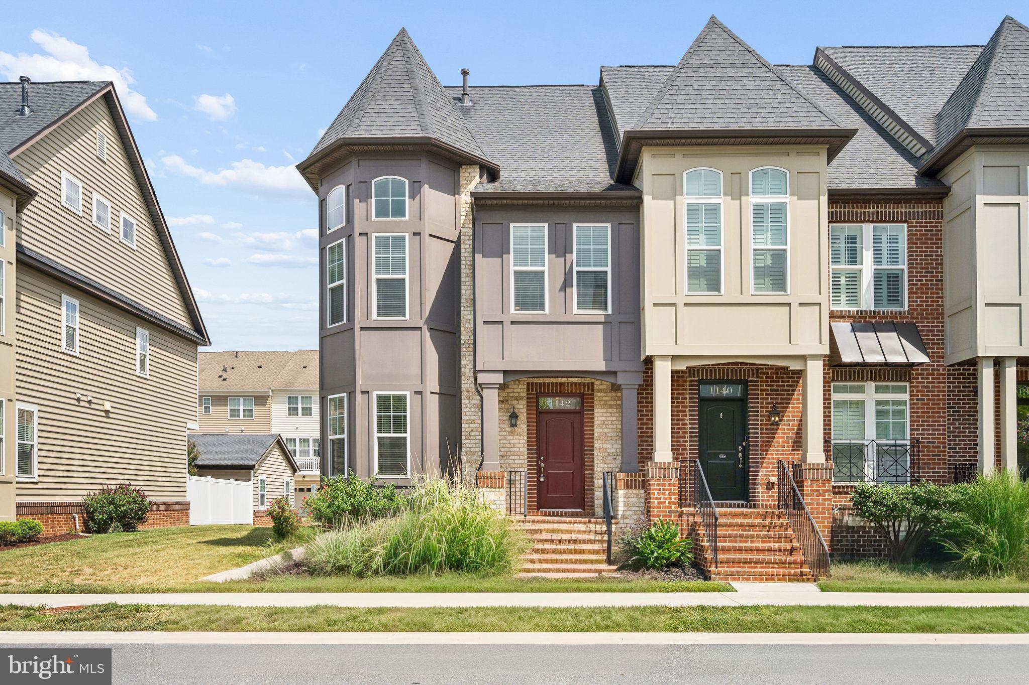 Welcome home to this stunning end-unit Wormald custom townhome, ideally located just minutes from vibrant Downtown Frederick. Designed with luxury and comfort in mind, this home features an open floor plan, beautiful natural oak hardwood flooring, and an abundance of windows that fill the space with natural light.

The spacious living room flows seamlessly into the gourmet kitchen, showcasing custom cabinetry, granite countertops, a ceramic tile backsplash, induction cooktop, oversized island with seating, and upscale stainless steel appliances. Just off the kitchen, the inviting family room features custom built-in bookcases and provides direct access to the private backyard patio—perfect for entertaining or relaxing outdoors. A convenient half bath completes the main level.

Upstairs, the spacious owner's suite offers a walk-in closet and a private en-suite bath. The second bedroom is generously sized, while the unique two-story third bedroom features dramatic windows and flexible space that would make an ideal home office, study, library, or creative retreat. A second full bathroom serves the secondary bedrooms.

The fourth level offers a versatile loft or sitting area that could be used as a lounge, bar, or media space, with direct access to the spectacular rooftop deck featuring a fireplace—an incredible place to relax, entertain guests, or enjoy evening sunsets.

The fully finished lower level provides a large recreation room, a third full bathroom, and endless possibilities for additional living space, a home gym, or guest accommodations.

Additional highlights include a detached two-car garage and access to the community swimming pool. Enjoy the convenience of being within walking distance of Downtown Frederick's award-winning restaurants, shops, breweries, and entertainment. This exceptional home combines luxury, style, and an unbeatable location.