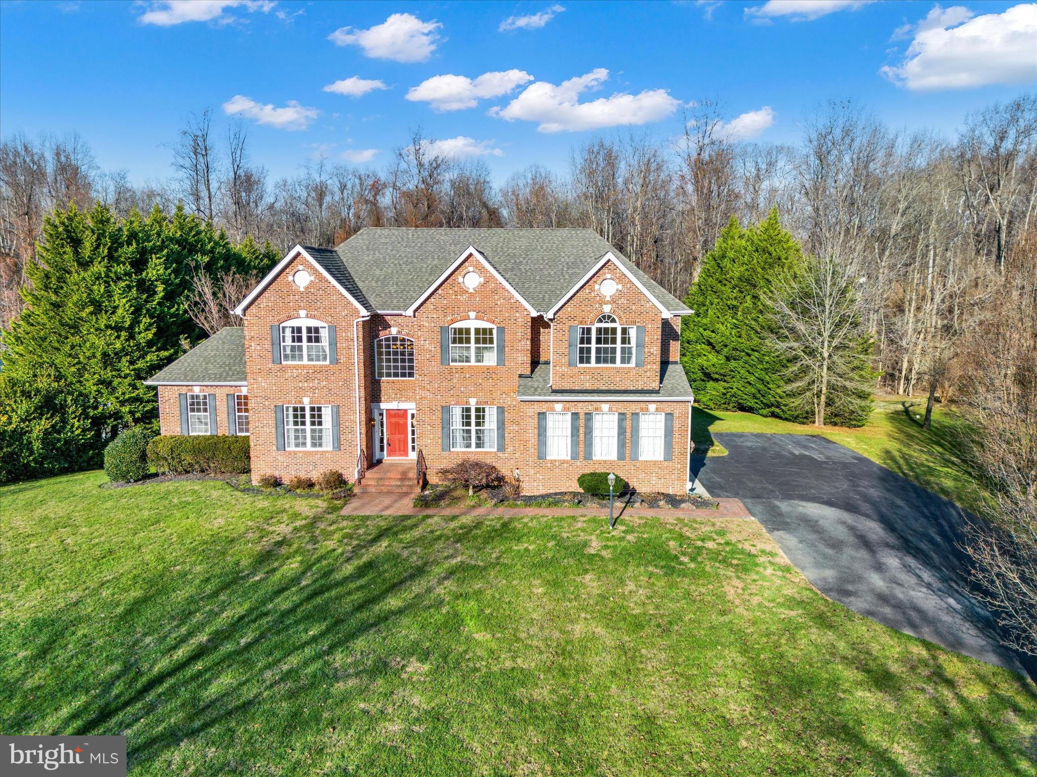 This immaculate estate nestled in prestigious sought after community of Lorin’s Pride. This exquisite property boasts three fully finished levels with two level extension over size thousand finished square feet, multiple private suites, and oversize two car garage. Perfect for multi-generational families. Upon entering the grand foyer, one is invited to private office/den, formal dining room, cascading stairs, open entertaining area on the main level. The main level features a well-appointed kitchen for the most discerning cooks offers upgraded appliances, oversized island, premium cabinetry, and ample counter space overlooking family room. The family room boasts gorgeous wood beam ceilings,  a soothing gas fireplace with extensive raised stone hearth, hook up for TV/electronics, and plush carpeting flooring. The kitchen bump put  leads to private deck. The upper level leads to luxurious owner's suite with tray ceiling, sitting room, amazing walk in closet with custom organizers, lavish bath with a separate in glass walk in shower, relaxing corner soaking tub, double bowl vanity, water closet, heated flooring. The additional features to the upper level include spacious second private suite with a walk in closet; third, and fourth bedrooms with large closets, ceiling fans, and  jack and jill bath with ceramic tile.  The laundry room on bedroom level offers great storage and full-size washer and dryer. The lower level, which could be a separate in-law suite, offers a generous kitchenette, to office/bedroom, full bath,  recreation room with columned entrance, dining area all with walk out level to backyard oasis. The main level offers access to oversize two car garages, long asphalt driveway. The garage offers extra special features include garage door openers with remote, utility sink, great storage area and more. French door leading from kitchen invites one to a private deck overlooking gorgeous backyard oasis  with large in-ground pool, professionally landscaped backyard backing to woods.  With front porch surrounded by professional landscaping, large deck and nearby community amenities and other local amenities, you'll enjoy a perfect setting for private relaxing and entertaining both inside and out. Fantastic shopping, recreational parks, trails, and restaurants and more minutes away.  Other updates include:  carpeting/padding (’15), hardwood floors were refinished (’17), Roof (’19), HWT (’21), AC unit in attic (’20), basement dishwasher (’21), pool pump and cover (’20).  Conveniently located to major routes include  Washington DC, Annapolis, So MD Technology Corridor, Joint Base Andrews, PAX Naval Station. Call today for you private tour.