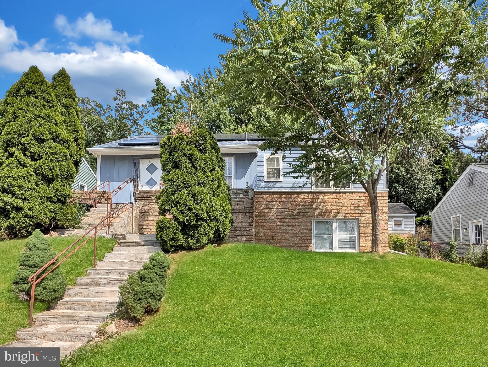 Spacious hilltop home with attractive cascading landscaping. Functional layout with 5 bedrooms, 2 full baths and 2 kitchens. Long driveway offers ample parking, with a separate section that can double as a patio, conveniently located near the kitchen entrance. Large backyard with a good-sized storage shed.  Don't miss this opportunity.