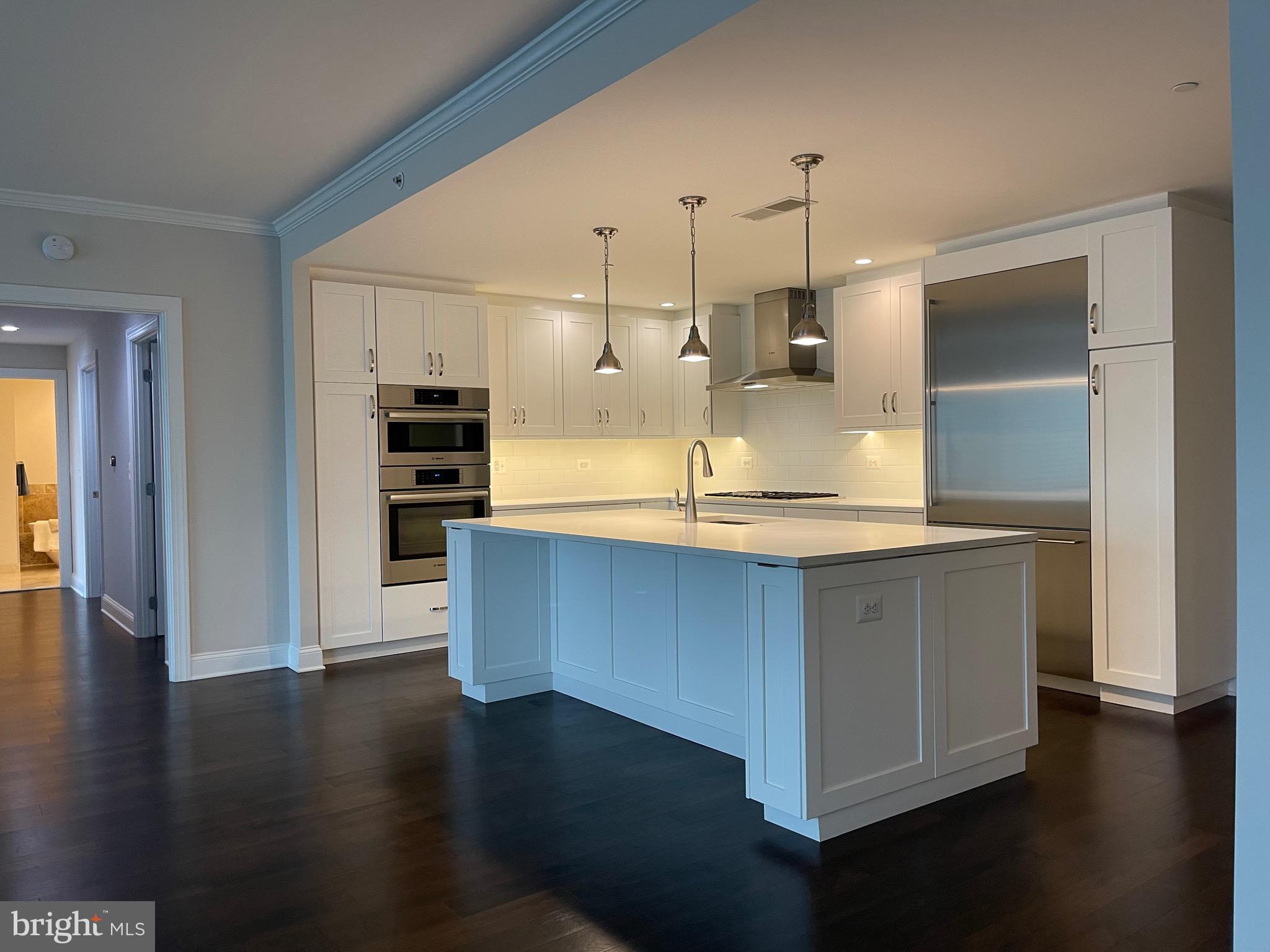 Oh just Wow! Dignified & Refined   just beautiful Hampden Row sprawling floor plan to Love with ginormous  Living & Dining and luxury Kitchen all open for todays lifestyle. Gagganeau & Bosch & white shimmering Quartz delights the eye. Bonus Den/Office too‼️ 3 huge California closet customized walk ins had  spared expense. Plus a refull size room for laundry and more storage. Terrific top roof deck - plenty of seating or grilling area.  Plus enhanced gym — in the heart of it all downtown New Bethesda  - practically next door to Metro 2 blocks away.