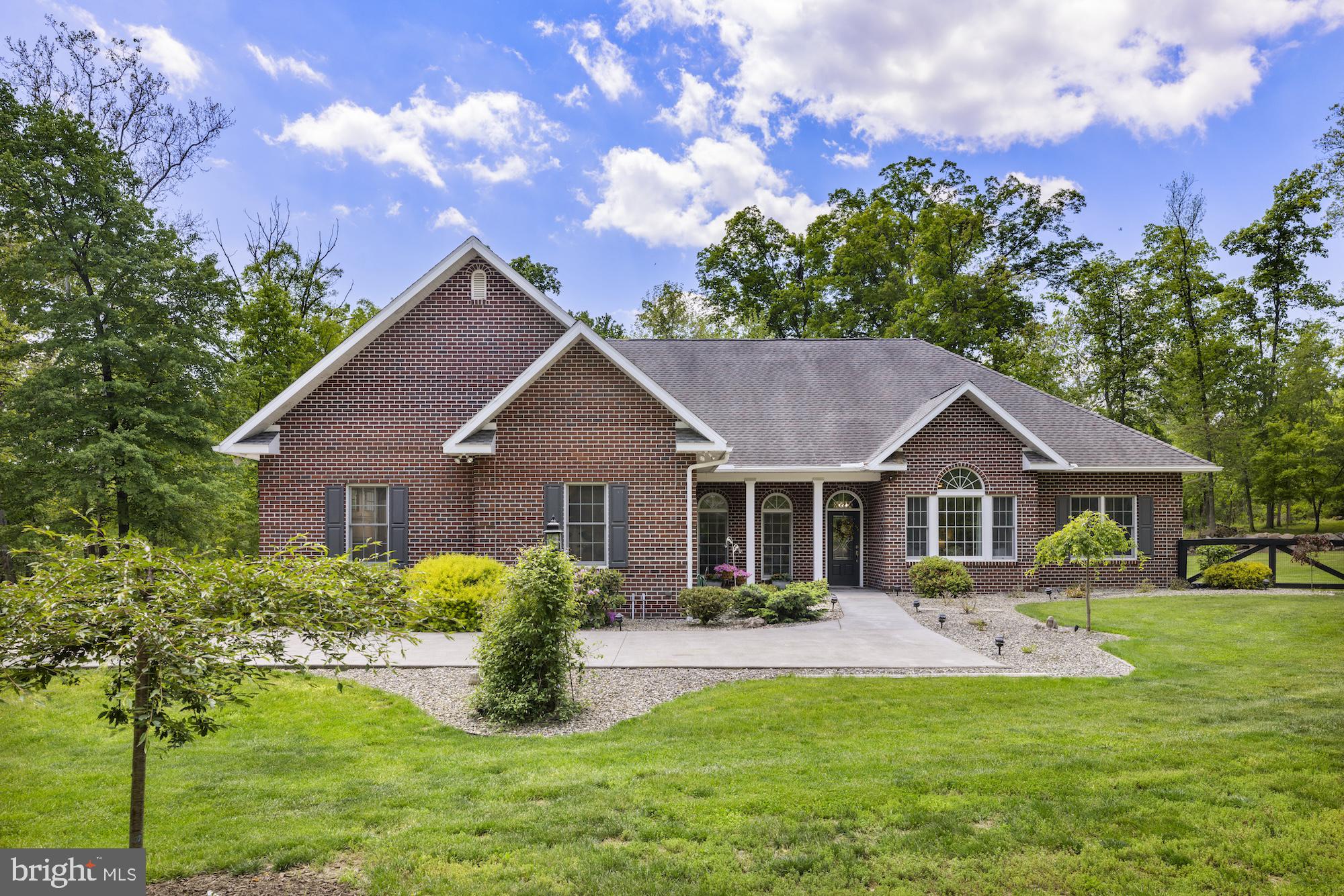 Custom-built brick rancher tucked away on a private dead-end street offering the perfect blend of seclusion, comfort, and quality craftsmanship. This beautifully renovated 3-bedroom, 2.5-bath home features 2,149 sq. ft. of open-concept living with soaring 9+ ft. ceilings, spacious primary with  recessed lighting and a desirable split-bedroom layout with Jack-and-Jill bath. Extensive 2020 renovations include ceramic tile flooring throughout, a completely updated kitchen, new bath vanities, trim, doors, lighting, ceiling fans, fresh paint, landscaping, and more.
Enjoy year-round comfort with radiant heated floors throughout the home, including the sunroom and oversized 3-car heated and cooled garage. Additional highlights include abundant floored storage above the garage, whole-house humidifier, Bryant generator, and a 4’ insulated concrete crawlspace with Bilco entry access.
Outdoor living shines with a screened-in porch featuring stamped concrete and ceiling fan, mature landscaping with butterfly bushes and crepe myrtles, storage shed, and peaceful natural surroundings filled with wildlife. A rare opportunity to own a meticulous maintained, move-in-ready home in a truly private setting.