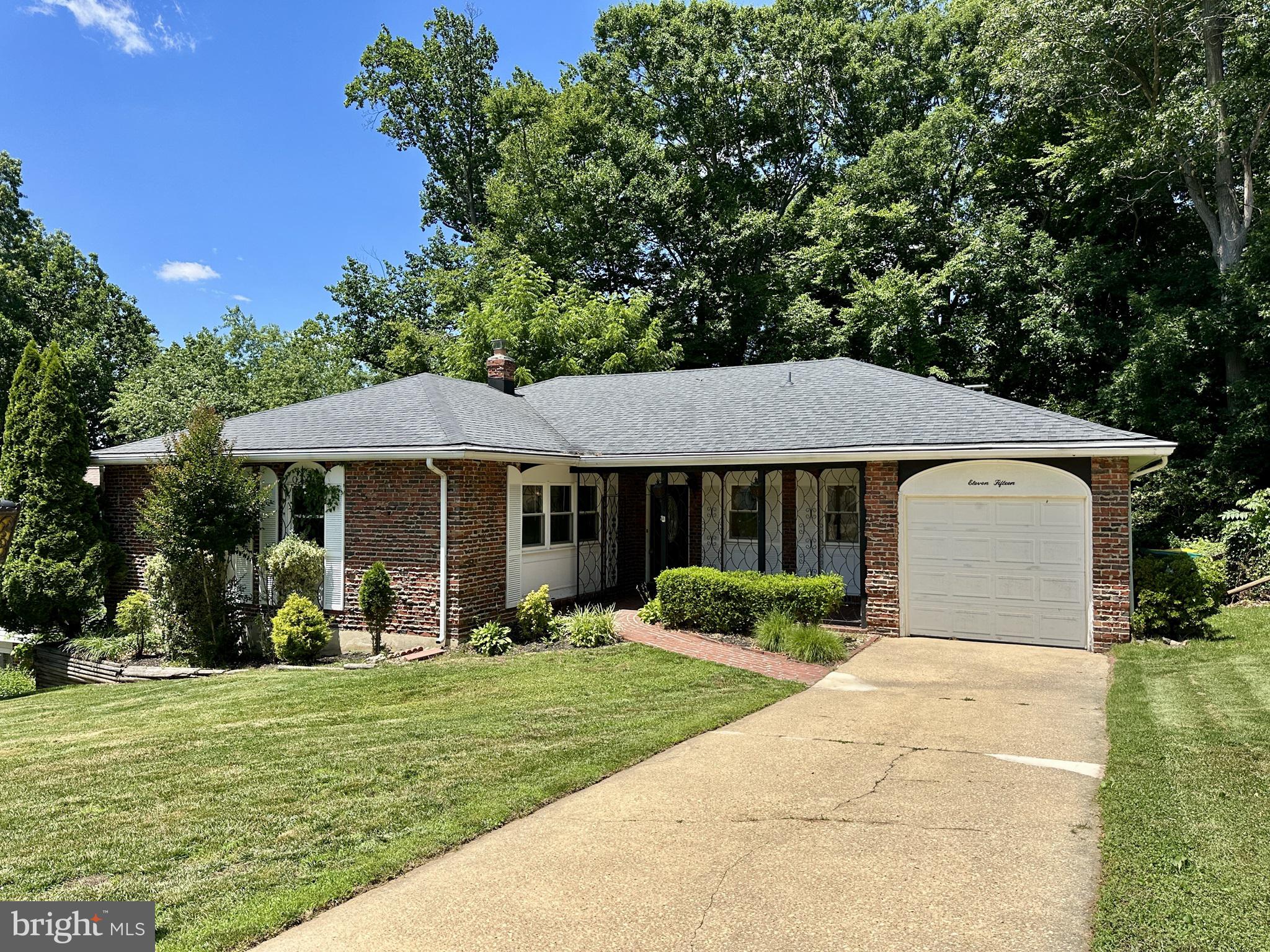 Attractive 3BR ranch home offering great value, welcoming curb appeal, mature trees, and a private backyard setting. Inside, a spacious foyer greets guests and opens to comfortable living spaces with LVP flooring flowing through most of the main level.  The eat-in kitchen offers abundant cabinetry along with stainless steel appliances, the family room features a fireplace and ceiling fan while the large formal living room is filled with natural light from expansive windows.  A formal dining room with sliding doors provides easy access to the elevated rear deck for outdoor enjoyment. The primary bedroom includes two closets and a ceiling fan.  There are two additional bedrooms and a spacious full bath that includes dual sinks and a hallway linen closet.  Convenient everyday features include a laundry room off the garage, two coat closets, and a powder room.  The daylight lower level expands the living space with a recreation area, sliding doors to the rear patio, two storage spaces, and a cedar closet.  Additional highlights include beautiful interior and exterior ironwork, an upgraded front door, vinyl windows, vinyl siding, attached one-car garage with opener, front brick patio, roof shingles (2015), elevated deck (2016), HVAC system (2023), and water heater (2024).  A well-maintained home with solid updates and plenty of opportunity to personalize over time.