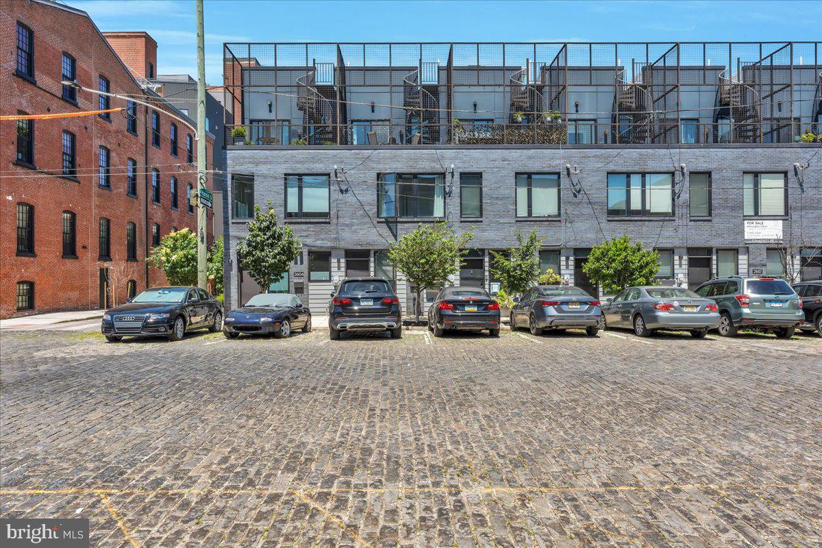 Welcome to 2606 Trenton Avenue, where modern living meets vibrant neighborhood energy. Nestled on an extra-wide cobblestone street just moments from the area's favorite restaurants, coffee shops, parks, and local hotspots on Frankford Ave, this home places the best of East Kensington right outside your door.
Inside, a bright open-concept features hardwood floors, oversized windows, and a spacious kitchen with quartz countertops, stainless steel appliances, and a breakfast bar. The second floor offers two spacious bedrooms, a full bath, and a dedicated laundry room. The entire third level is dedicated to the primary suite, complete with a spa-like bath featuring a double vanity and soaking tub. Above it all, a private deck and expansive roof deck provide amazing views. The fully finished basement is the perfect space for a home gym, office, playroom or guest room featuring a beautiful full bathroom. 

One block from POPS Park, featuring a playground, splash pad, dog park, skatepark and basketball court. Walkable to the Market Frankford Line, shops and restaurants on Frankford Ave. Neighborhood favorites: Cook & Shaker, Korea Taqueria, Little Susie's Meeting House, Fiore, Vessel Coffee, Picnic, and so many more!