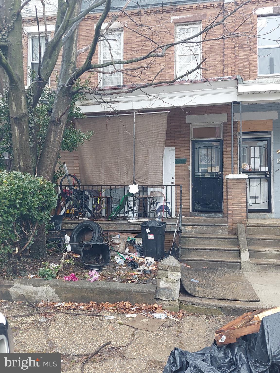 property is currently set up as a duplex (zoned RSA-5) and features 3 bedrooms, and 2 bathrooms. 
The property is currently occupied by unauthorized occupants (squatters). No interior access or showings permitted. Do not contact or disturb occupants. Drive-by viewings only.