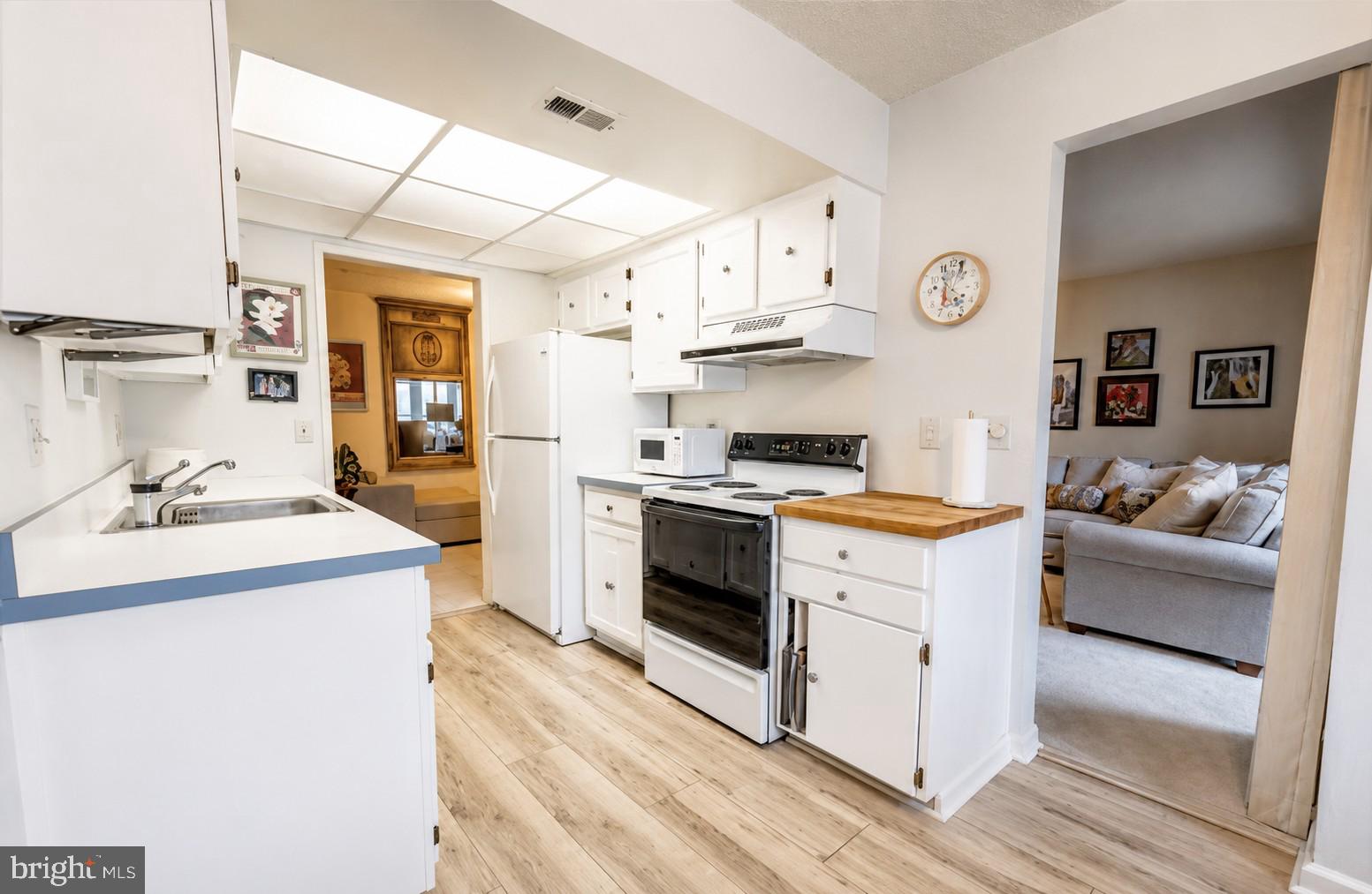 CONDO FEE INCLUDES ALL UTILITIES! Welcome to the vibrant 55+ community of Leisure World! This well-maintained, seller-occupied 3-bedroom, 2 full bath condo offers a spacious, comfortable layout designed for easy living. Wake up to beautiful morning sunlight in the kitchen and enclosed balcony. Brand new water heater installed in June 2026. The unit also comes with one assigned parking space and a 4x4 storage cage for added storage. Enjoy resort-style living with access to multiple clubhouses, indoor and outdoor pools, a fitness center, an 18-hole championship golf course complete with a driving range and pro shop, and more! Conveniently located just outside the main gate, Leisure World Plaza offers Giant Food, banking, dining, and everyday essentials right at your doorstep.
