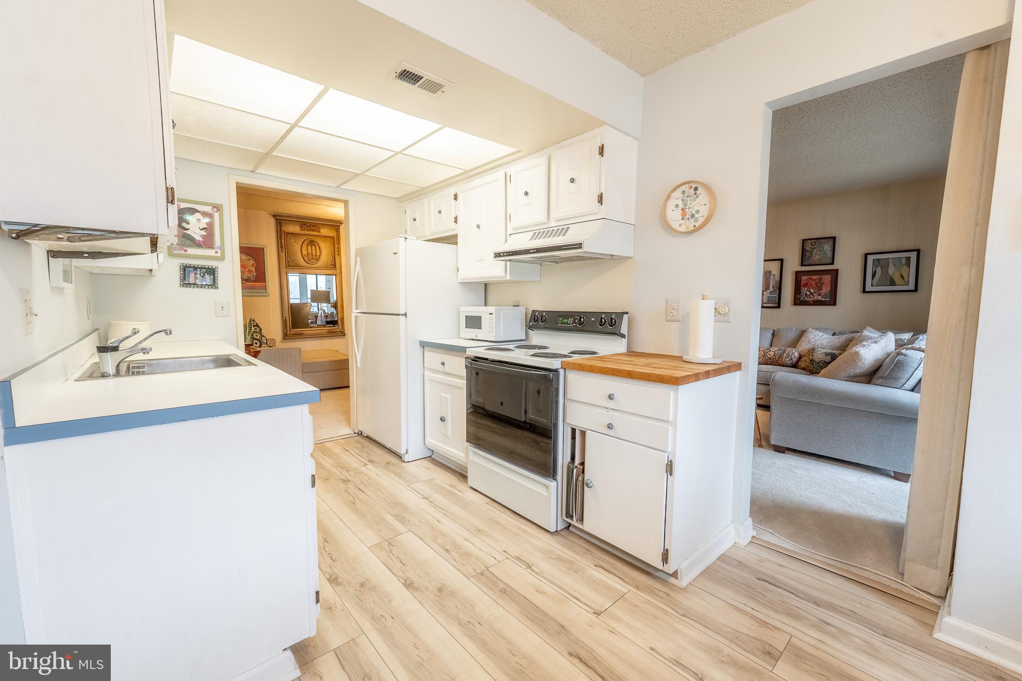 Welcome to the vibrant 55+ community of Leisure World! This well-maintained, seller-occupied 3-bedroom, 2 full bath condo offers a spacious, comfortable layout designed for easy living. Wake up to beautiful morning sunlight in the kitchen and enclosed balcony. Brand new water heater installed in June 2026. The condo fee includes ALL utilities, providing exceptional value and convenience. The unit also comes with one assigned parking space and a 4x4 storage cage for added storage. Enjoy resort-style living with access to multiple clubhouses, indoor and outdoor pools, a fitness center, an 18-hole championship golf course complete with a driving range and pro shop, and more! Conveniently located just outside the main gate, Leisure World Plaza offers Giant Food, banking, dining, and everyday essentials right at your doorstep.