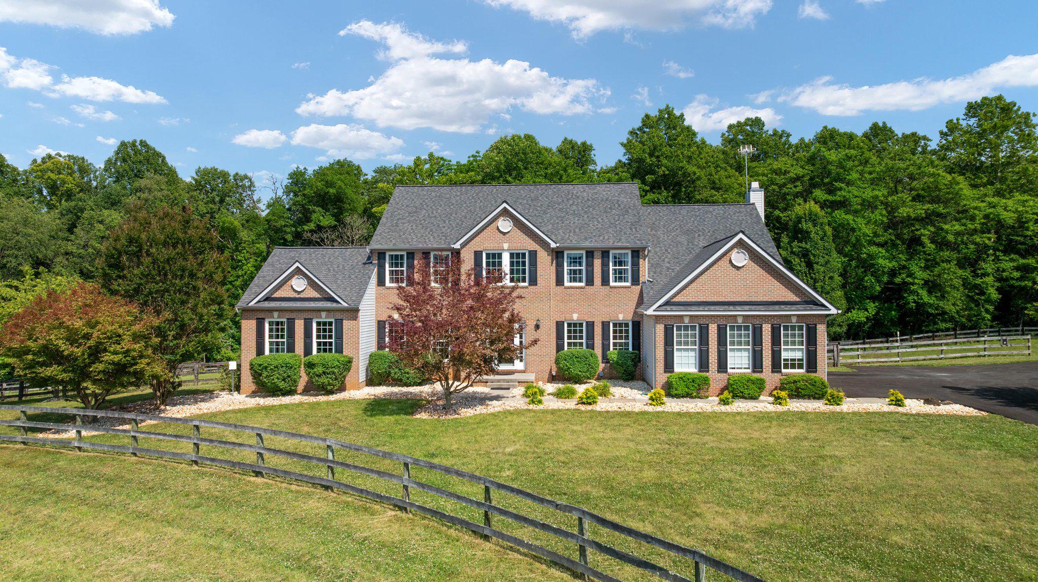 🏡 38689 Cassia Lane | Lovettsville, VA 20180 🌄

5 Bedrooms | 4.5 Bathrooms | 10.27 Private Acres

✨ A Rare Western Loudoun Estate Offering Privacy, Views, Equestrian Amenities & Exceptional Upgrades

Perched on one of the highest points in the neighborhood, this remarkable 5-bedroom, 4.5-bathroom estate sits on 10.27 picturesque acres and showcases breathtaking, unobstructed panoramic views that stretch for miles. From stunning sunsets to peaceful mornings overlooking the rolling countryside, every day feels like a retreat.

🌅 Enjoy some of the most spectacular views in the area from your expansive deck and completely private backyard. With no rear neighbors and your own private woods behind the home, you'll experience unmatched tranquility and seclusion while remaining conveniently located near the amenities of Western Loudoun County.

🌳 Own your own forest.
🥾 Explore private trails.
🦌 Watch abundant wildlife.
🏹 Hunt on your own land.

For horse enthusiasts and outdoor lovers, the property is truly exceptional:

🐴 Premium Sunset Barns horse run-in shed with tack room
🐴 Five separate fenced paddock areas for horses and livestock
🐔 Large heavy-duty chicken coop for hobby farming or homesteading
🚜 Plenty of room for gardening, recreation, and outdoor adventures

Arrive home via the newly paved asphalt driveway leading to a detached 3-car garage/workshop featuring an automotive lift—perfect for car enthusiasts, hobbyists, contractors, or additional storage needs.

Inside, the home offers spacious living areas and an impressive list of recent upgrades and improvements:

✨ Beautiful hardwood floors
✨ Renovated luxury primary bathroom
✨ Updated Jack-and-Jill bathroom
✨ Upgraded powder room
✨ Extended laundry room with added functionality and storage
✨ Fully equipped basement kitchen—ideal for entertaining, multi-generational living, guests, or an in-law suite
✨ Pellet stove in the basement for cozy, efficient warmth
✨ New front windows
✨ New basement sliding glass door
✨ Three newer HVAC systems for year-round comfort
✨ New roof on both the main residence and detached garage/workshop

Whether you're seeking an equestrian property, private retreat, homestead, multi-generational living opportunity, or simply a home with breathtaking views and room to roam, 38689 Cassia Lane delivers a lifestyle that is increasingly difficult to find in Loudoun County.

🏡 5 Bedrooms
🛁 4.5 Bathrooms
🌳 10.27 Acres
🌅 Unobstructed Scenic Views
🐴 Equestrian Ready
🔧 3-Car Garage & Workshop with Auto Lift
🌲 Private Woods & Hunting Opportunities
🐔 Homestead Features
✨ Extensively Updated Throughout

Experience the perfect blend of luxury, privacy, acreage, and country living—all from one extraordinary property.💫