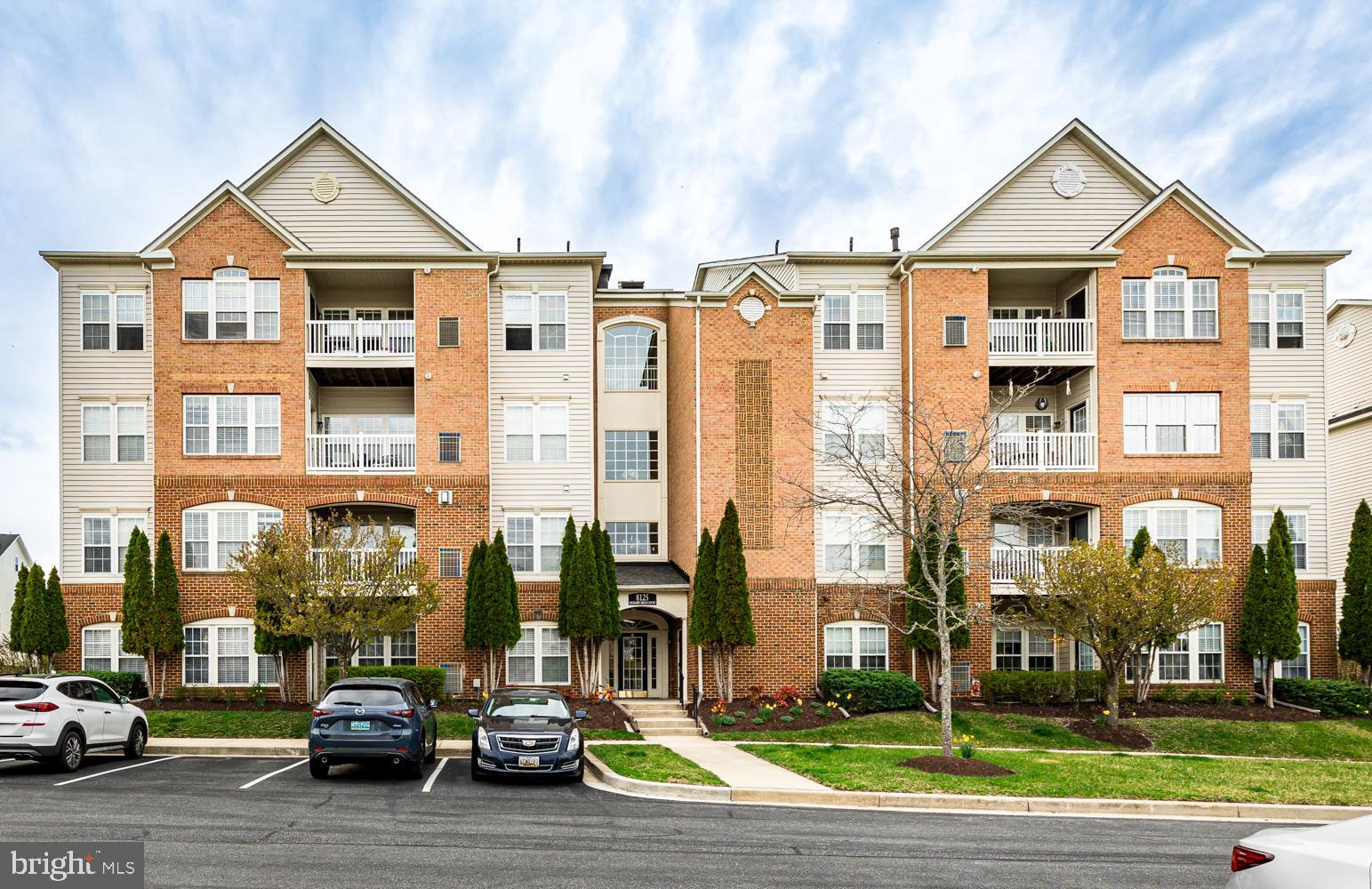 Welcome to Heartstone at Village Crest, a 55+ amenity rich community.  This Penthouse condo feels so spacious and bright with high ceilings.  Enter into an open living and dining space with adjacent kitchen with eat in area.  Living area with a gas fireplace and ceiling fan, adorned by natural light from multiple windows.  Beautiful kitchen has granite countertops, tile backsplash, tile flooring, and stainless steel appliances. Adjacent to a  eat-in space with many windows and door to a private balcony.  Storage area in closet on balcony, also houses furnace and water heater.  One end of condo has bedroom 2 with a full hall bath.  Primary suite is on opposite side of condo.  Spacious  primary with plenty of room for your bedroom furniture, plus a  bump out allows additional space for a sitting or desk area.  This primary bedroom also has a large walk in closet and attached primary bath.  Primary bath with dual vanity,  clean white vanity and counter, updated lighting, tile shower with built in bench, linen closet. Separate closet in hallway for washer and dryer. Foyer has a coat closet plus a large storage closet.  Brand new carpet.  Shared closet in hallway for additional storage.  Shared grocery carts in stairwell make bringing items up to the unit easy.
Amenity rich community includes the senior center with indoor pool, fitness center, community room, meeting rooms, and game room.  Taylor Village outdoor pool, tennis court, and tot lot is also included for this community.