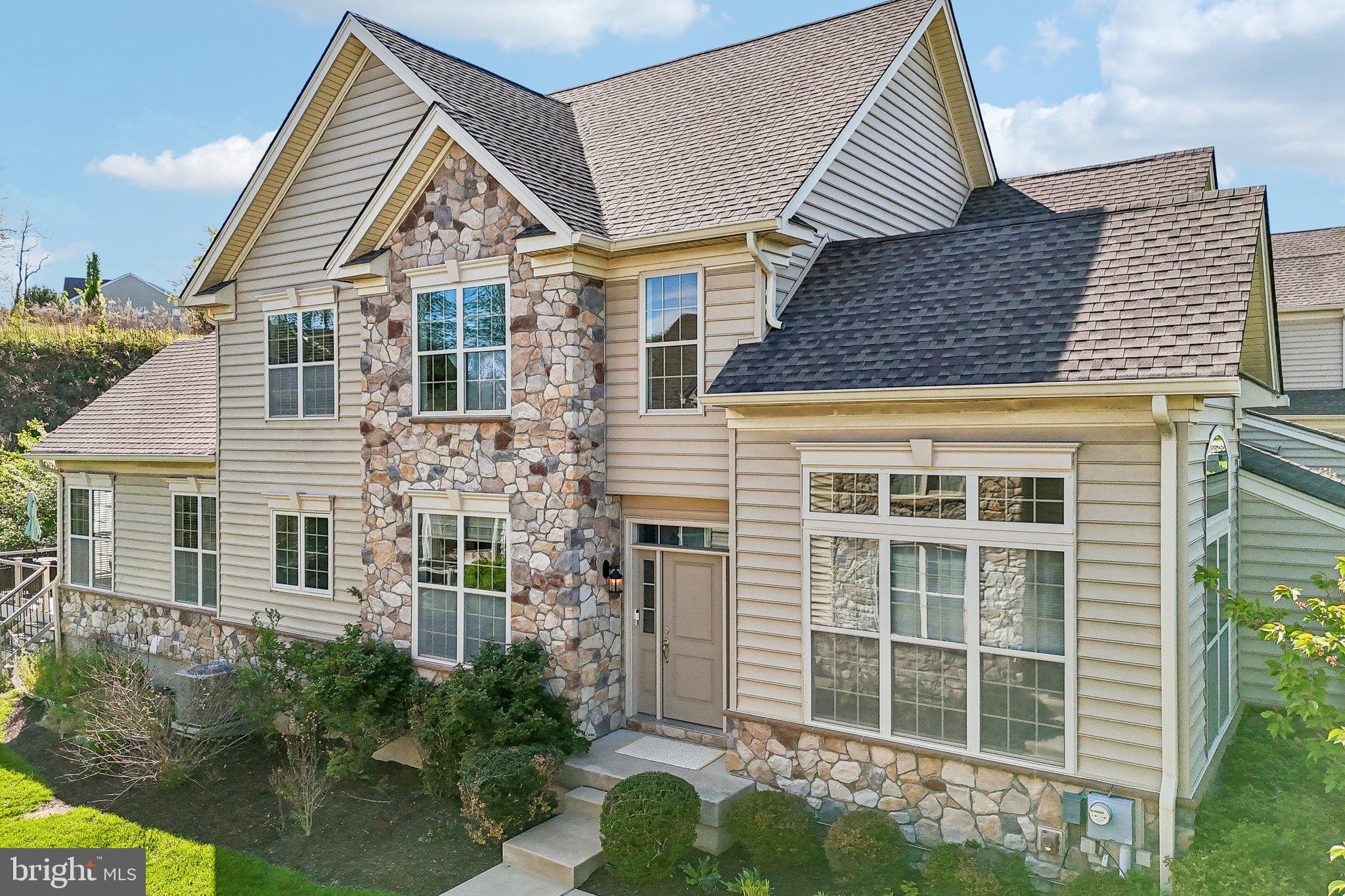 Welcome to 3045 Rainer Rd, an exceptional twin carriage home in the prestigious Byers Station community offering over 4,400 sq. ft. of beautifully designed living space. This sun-filled residence features 4 bedrooms, 3.5 baths, and a desirable first-floor primary suite with two walk-in closets and a spa-inspired bath. A dramatic two-story foyer opens to elegant formal living and dining areas, while the expansive family room showcases soaring ceilings, oversized windows, and a cozy gas fireplace. Beautiful hardwood flooring flows throughout the entire first floor, complemented by a convenient powder room and thoughtfully placed laundry room.

The gourmet kitchen is beautifully designed with granite countertops, upgraded cabinetry, tile backsplash, a large center island, stainless steel appliances, a wall oven with built-in microwave above, and a custom range hood that adds both style and sophistication. Just off the main living area, step onto your private composite deck — a maintenance-free outdoor retreat offering exceptional privacy and serene surroundings, perfect for morning coffee, evening gatherings, or simply unwinding in peace.

Upstairs, a spacious loft provides flexible living space ideal for a media room, home office, or potential additional bedroom, along with two generously sized bedrooms and a full bath. The newly finished 1,300+ sq. ft. basement adds incredible versatility with a large recreation area, an additional bedroom, full bath, and abundant storage space. Additional highlights include dual-zone HVAC, whole-house water filtration and softener systems, plentiful storage throughout, a two-car garage, private driveway parking, and convenient guest parking nearby.

Enjoy resort-style community amenities including a clubhouse, pool, tennis courts, playgrounds, and scenic walking trails, with easy access to Marsh Creek State Park, Exton shopping and dining, and major highways. Schedule your showing today and experience the lifestyle and comfort that 3045 Rainer Rd has to offer.