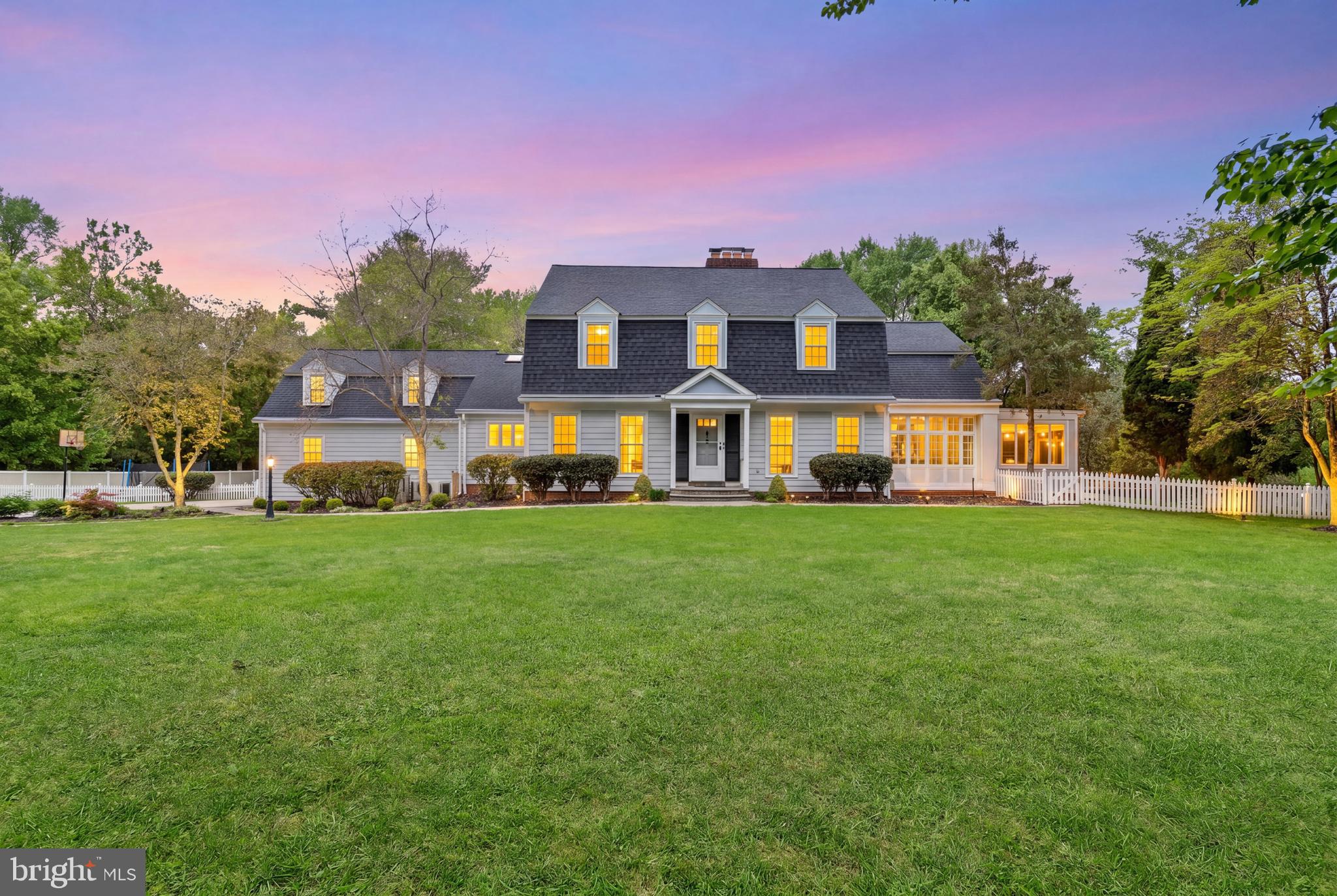 Welcome to 12100 Drews Ct, a beautiful home on a prime location, near the scenic C & O Canal and Potomac Village. This elegant residence features 4 spacious bedrooms and 5 full bathrooms, with many upgrades throughout.  Set on a spectacular, private 2-acre lot, this property is enhanced by a new fence and mature, tree-lined surroundings, creating a serene town-and-country feel.  Sun-filled interiors overlook the stunning grounds, which include a welcoming patio, a 20 x 40 pool, and a built-in grill, perfect for entertaining in complete privacy.  The main level offers formal dining and living rooms, an open-concept kitchen, a bright breakfast room with vaulted ceilings, and a beautiful family room with a beamed ceiling and wood-burning fireplace, which leads to an amazing light-filled sunroom with high ceilings and built-ins, and a beautiful room that can be used as an office or playroom. On the second level, the master bedroom is a true retreat, featuring a beautiful, updated, large bathroom with a soaking tub and a spacious walk-in closet. On this level, you will also find a charming surprise attic room tucked above one of the bedrooms, offering flexible space.  This exceptional Potomac property blends luxury, comfort, privacy, and an unbeatable location, offering the perfect balance of elegant living and peaceful surroundings.