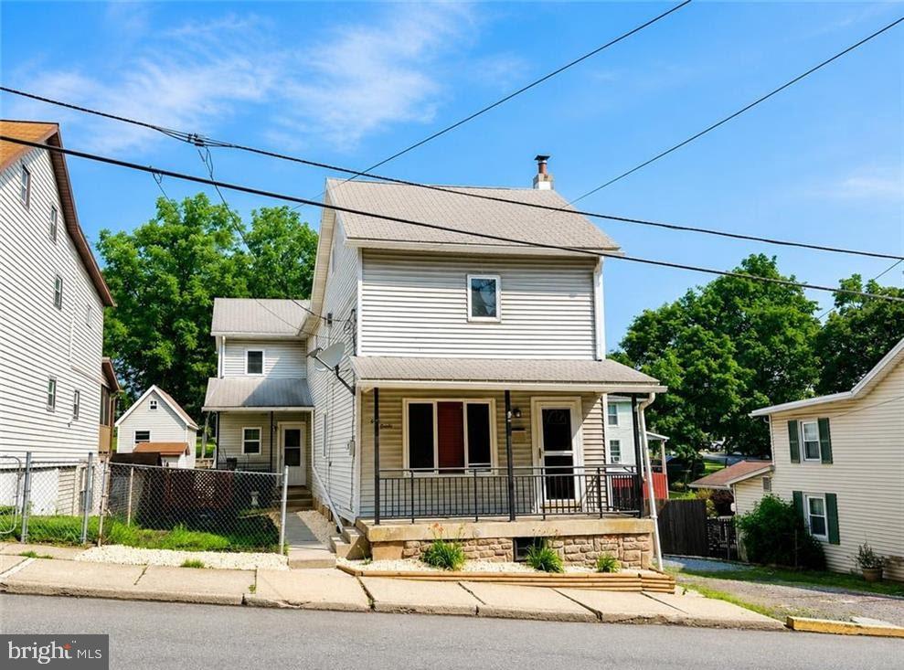 Fantastic opportunity to own this affordable 4-bedroom, 2 full bath home in the heart of Lehighton! Situated on a double lot, this property offers an abundance of off-street parking, a spacious fully fenced yard, and plenty of room to enjoy both inside and out. Major improvements have already been completed by the current owner, including new flooring throughout the entire first floor, a beautifully remodeled kitchen, two completely renovated full bathrooms (one on each level), and a new mini-split system in the kitchen/dining area for added comfort. The flexible floor plan features a spacious double living room with a cozy wood-burning stove or the option for an open-concept living and dining space. Additional highlights include convenient first-floor laundry, a first-floor full bath with a walk-in shower, and a second-floor full bath with a tub/shower combination. Bring your ideas and imagination for renovating the second-floor bedrooms and oversized hallway, adding your own personal style while building instant equity. Outside, you'll find a detached one-car garage with alley access, an attached workshop/storage shed, an additional garden shed, two garden areas, and a huge 25' x 14' covered deck just off the kitchen—perfect for entertaining. The fenced backyard also features a double gate for easy access from the front parking area and a walk-out from the basement. Conveniently located just minutes from Routes 209, 248, and the PA Turnpike, as well as shopping, dining, schools, and outdoor recreation, this property offers the rare combination of a spacious in-town yard, numerous updates, and exceptional value. Schedule your private showing today!