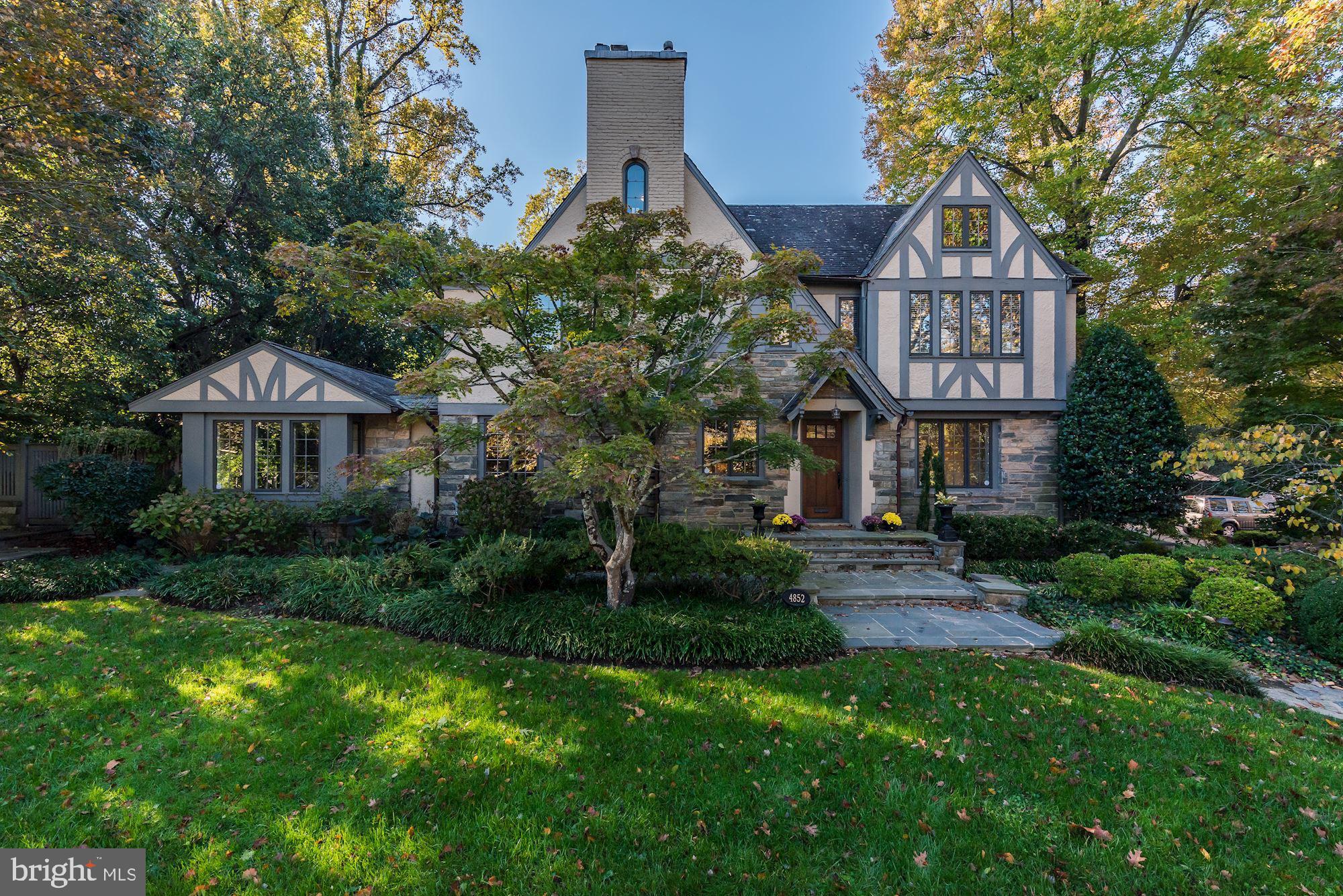 Exquisite residence with a stately Tudor exterior and smashing contemporary interior - on one of D.C.'s most desirable streets! This smart renovated property blends a traditional exterior befitting the neighborhood with a chic, fresh interior, and offers a heated pool and patio space on sprawling landscaped  grounds. Four finished levels provide 8100 sq ft of custom renovated living space, 6 BRs, 6.5 BAs, and a 2-car attached garage. A grand entry foyer leads to  beautiful Living Room with coffered ceiling, large formal Dining Room, and expansive Great Room with doors to the patio. Large contemporary Kitchen with marble center isle and banquette seating. Wonderful flow from space to space, exceptional windows, beautiful hardwood floors, exquisite trim work, custom built-ins and fixtures, create the perfect environment for entertaining and every-day living. The first upper level offers a Primary Suite with a large Bedroom, smashing renovated bath, closets, and sitting area with built-ins. Three addition bedrooms on this level share two renovated baths. The top level offers an additional bedroom, and wonderful Office or play space. The lower level offers a large Recreation Room, au pair suite, separate laundry room and large wine cellar. Truly an exquisite property and rare offering.