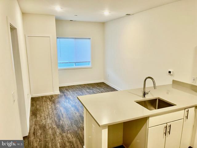 Brand new modern 1 bedroom apartment complete with in-unit laundry, dishwasher and central air.  Advertised Rent is based on a 14 month lease.  Bright and sunny 2nd floor floor unit features high quality finishes like quartz countertops, stainless steel appliances and sturdy engineered hardwood floors.  The highlight of the kitchen is the 7 foot counter/breakfast bar which sits 3 stools comfortably.  You’ll also find plenty of storage in ample kitchen cabinets and closet space.  The large bedroom has cozy brand new carpet.  Handy features include secure key-access, package room and responsive property management.  Grocery Outlet steps away.  Easy access to transit at Broad or Girard.   We can’t wait to show you this amazing apartment.  (Photos are not of exact unit)