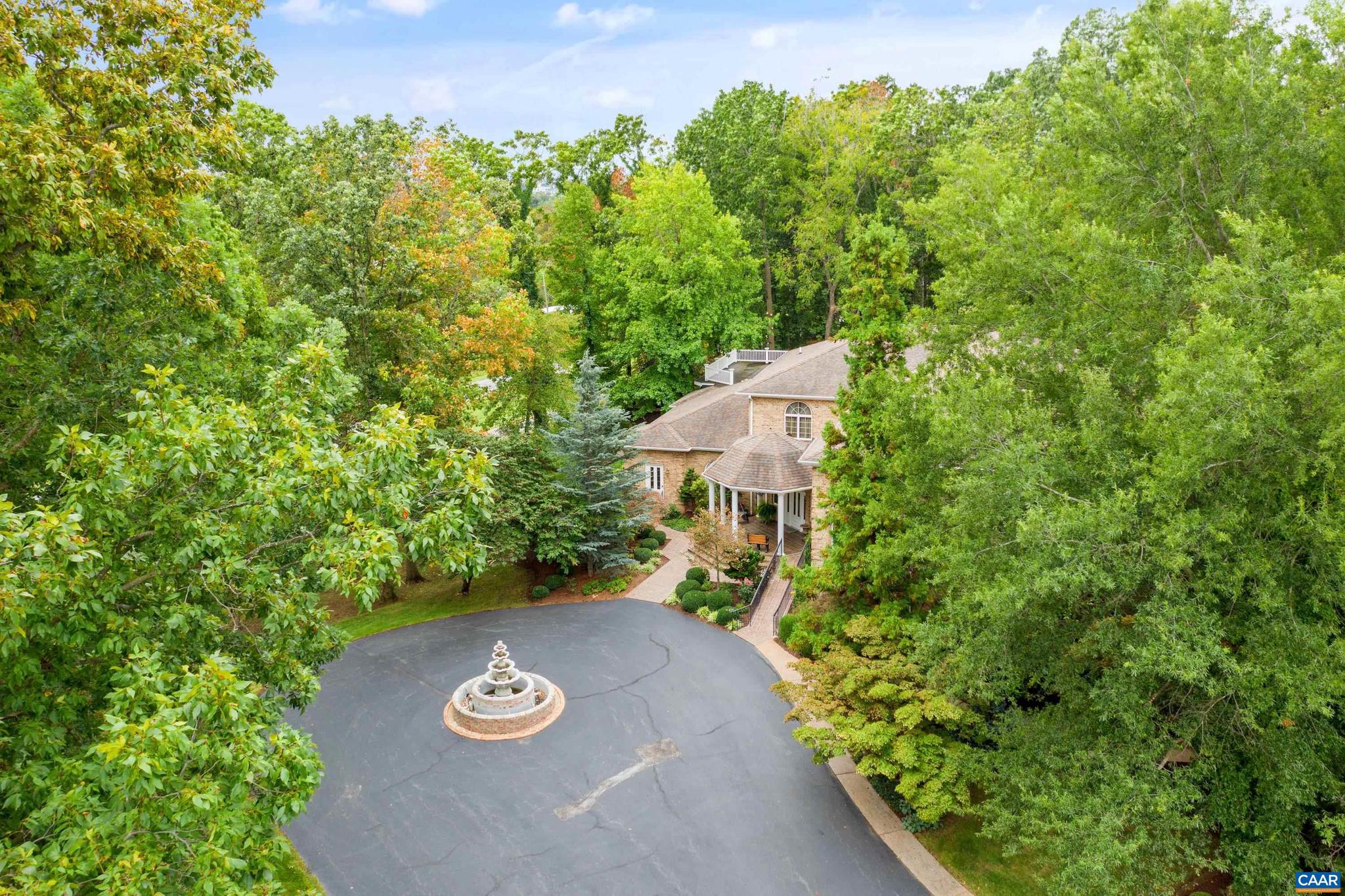 Beauty abounds at this lovely French provincial style property, conveniently located on Route 33, near Massanutten.  Enter through handsomely crafted stone pillars, with lights and an electric wrought-iron gate, and follow the driveway around the immaculately maintained grounds filled with lush landscaping. Grounds also feature a replica of the historic Mabry Mill, a pond, multiple courtyards, stone paths, walkways, and more.  The exterior features expertly crafted quoin brickwork, arches, and stone masonry, with expansive covered brick patios.  Enter the property through a grand front entrance into a large foyer and gallery/great room.  The main level features a great room, kitchen, sunroom, multiple offices, workspace, and a production wing (currently used for business purposes). The second level features the residence with three primary bedroom and ensuite bathrooms, a luxurious dining room, a spacious kitchen with an island and plenty of countertop and cabinetry space.  The property currently operates with a special use permit for a photography studio. Other business opportunities are allowed in A2 zoning, check with your real estate agent or the county for more details.,Formica Counter,Oak Cabinets,Fireplace in Great Room,Fireplace in Kitchen,Fireplace in Living Room