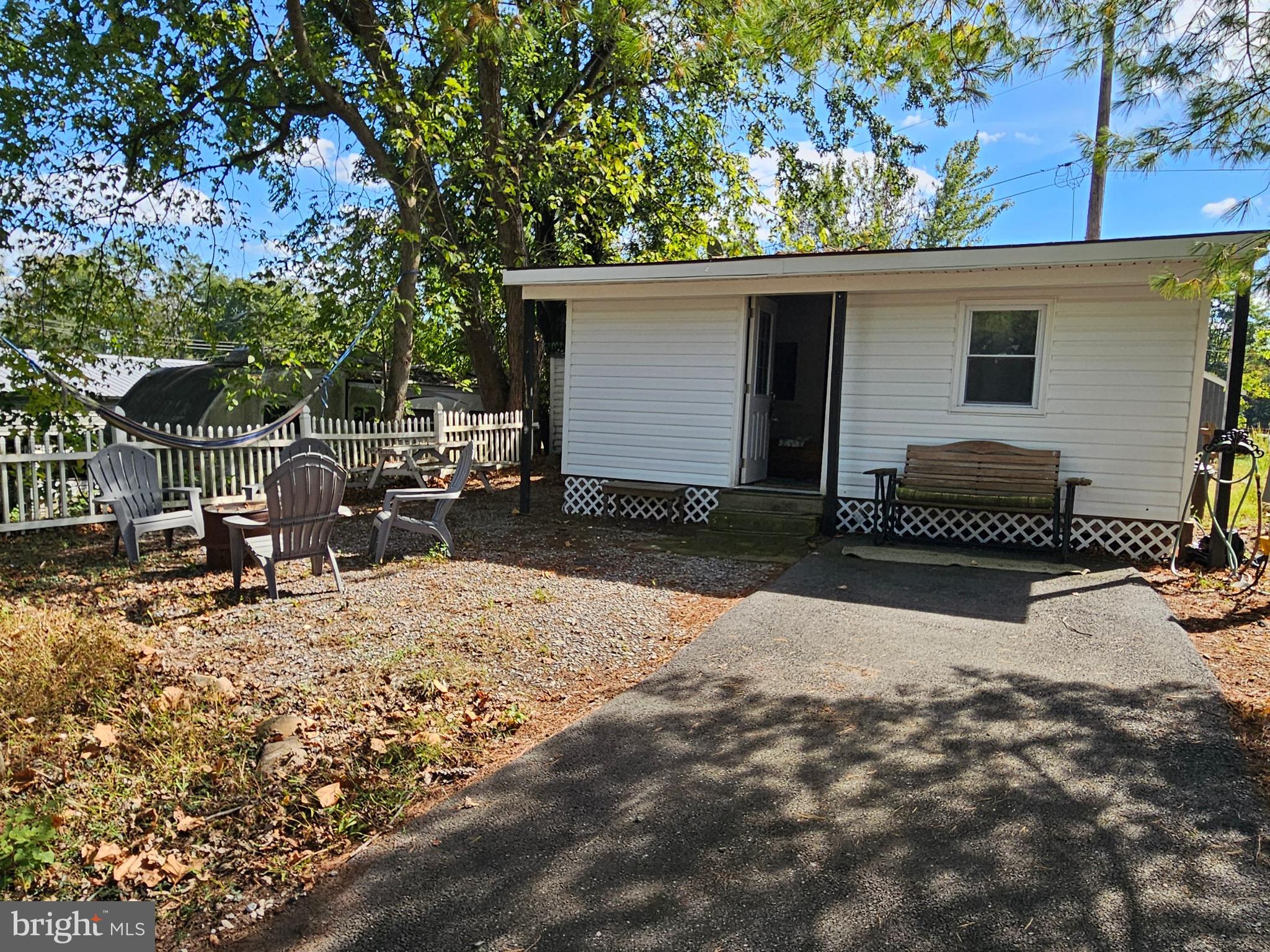 Bring us an offer! Must sell

Welcome to Block 21 Lot 4 Old Faceful st (On SEWER) in Riverbends Rv Campground. Riverbend is 400 Acres of SEASONAL recreational campground full of amenities located on the Potomac River in Falling Waters, Wv. OPEN APRIL 1 - NOVEMBER 1 - 
Financing could be available. They require a minimum of 25% down of purchase price or appraised value whichever is less plus closing costs. Our maximum loan term is 15 years. The property CANNOT be in the flood plain. Minimum credit score of 700. 

This is a fun & entertaining community for all ages, yet relaxing. Old Faceful is a tucked away pretty quiet street and on this lot it features a move in ready, beautifully redone camping spot with all new paint, floors, light fixtures and more. This Cabin style features an enclosed deck set up as a living room to relax or host friends and family inside and away from the weather elements. A walk on in, is an additional living room space to be used for whatever your heart desires. Literally everything you see conveys. Off of the living area is a bedroom with a new Queen bed. Stocked Kitchen and ready to be used to make memories! Outside you;ll find a paved drive way and gravel a up and around the cabin for additional parking to the shed or use it as a yard to have a camp fire. Everything in the shed conveys including washer, dryer, and electric golf cart that needs new batteries. Don't wait on this one!


 Call today for your personal tour. Approx. 10 miles of Deep water on the Potomac River access for boating, fishing & swimming. Yearly membership ($1,987) plus a $200 initiation fee for new owners, includes water, Pump outs, electric, trash and the park amenities such as 3 pools, putt putt course, Horseshoe club, Boat club, Poker runs, Trick or Treat, Christmas in July, live bands, basketball court, tennis court, fireworks, car show, Church, restaurant, bar, convenience store (Great food), playground, volleyball, ball field and much much more. Join the Riverbend Boat Club.  Bring your golf carts, water toys and come enjoy life!
