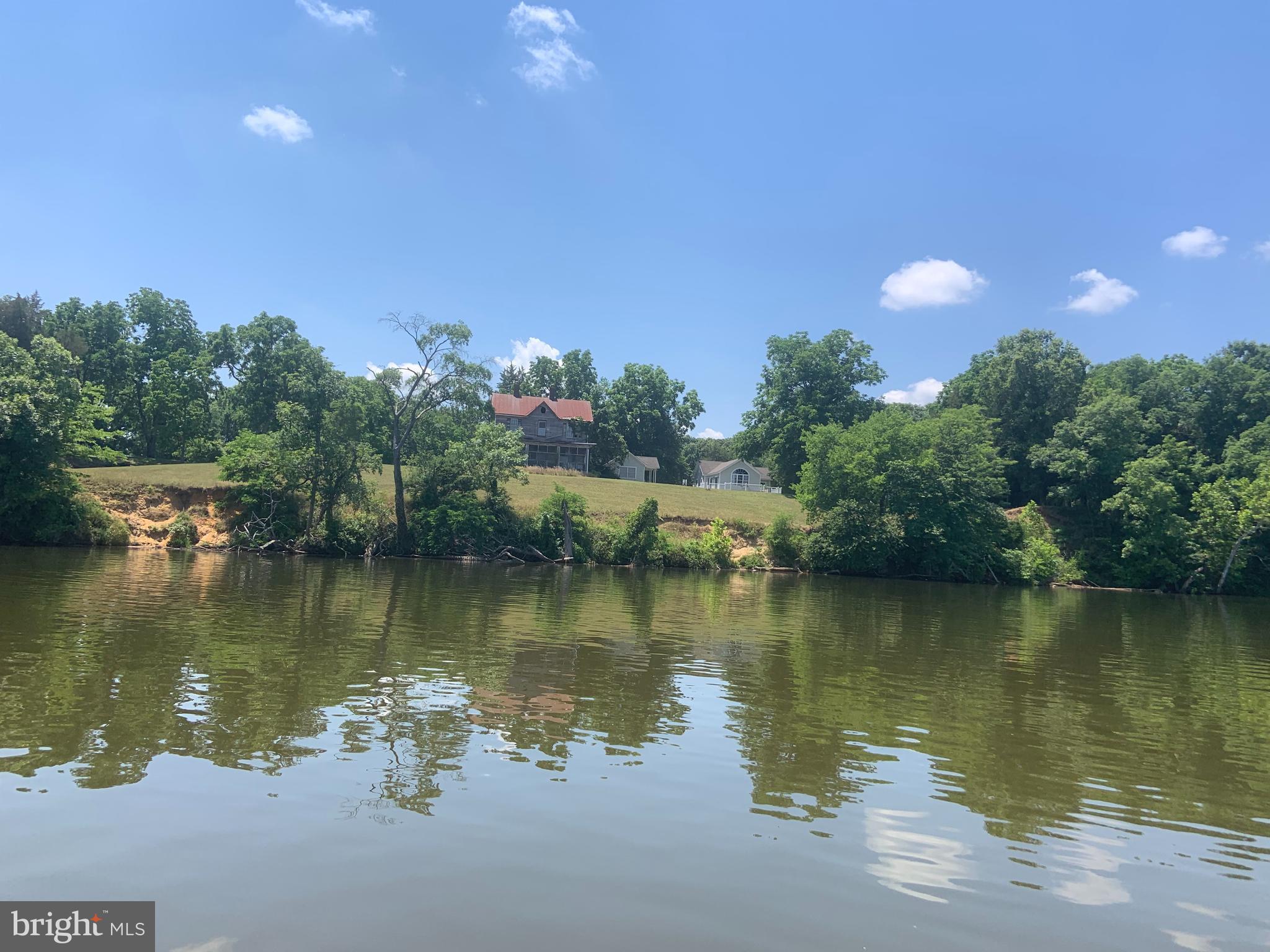 Super unique and Rare opportunity to own a huge 88 acre waterfront estate with approximately 7,035 ft or 1.3 miles of tidal waterfront, majority along the Panoramic scenic Rappahannock River on deep water channel side. Cottage style home with loft plus tiny home that is approx 300 sqft.  Live in either home while you build your dream home.   Old abandoned home located perfectly on knoll to overlook river with long North, south and east exposures. Rare flat access near channel perfect for future boat ramp and even a Sandy beach. Waverly farm dates back into the 1700s. Located just south on town of Port Royal. Some fencing still in place. Bring your horses and ride along the river. Property access through 20ft right on way through Cedar Fork Farm.   Past survey check stated over 100 acres measuring center of Mill creek to center of Roy’s run, some that that land under water.  Mass measurement at approximately 88 acres. 50 acre flat and high.