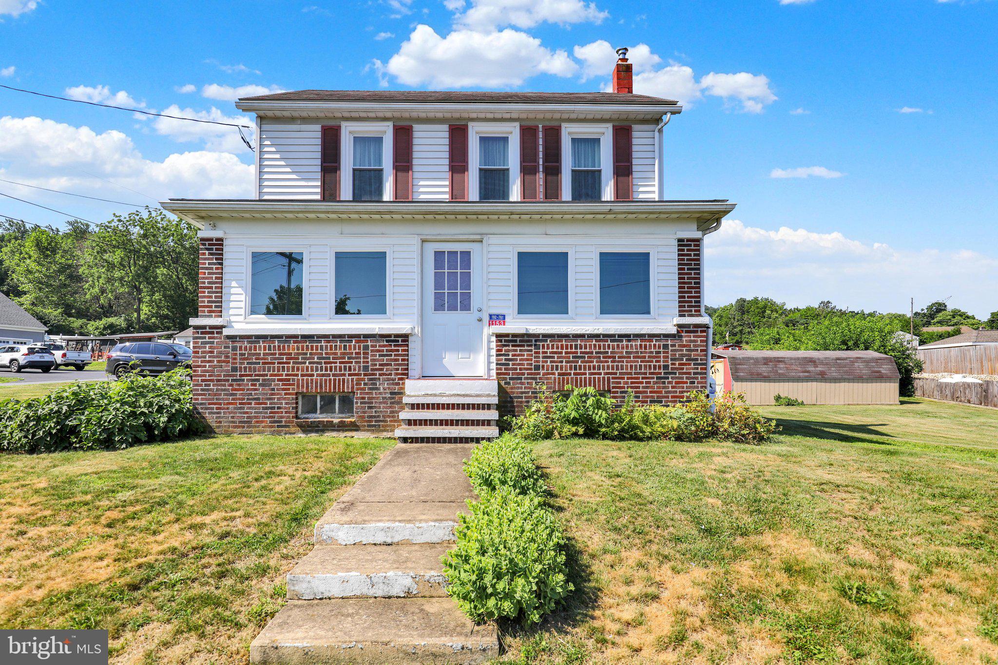 Move right into this well maintained 1880 two-story farmhouse, ideally situated on an almost half-acre lot in the highly sought-after Wilson School District.

The welcoming main level features durable Pergo flooring, a spacious living room accented with wainscoting and a beadboard ceiling with faux beams, a formal dining room highlighted by a charming antique hobnail light fixture, and a cozy kitchen complete with a breakfast counter, seating, and all appliances included. Just off the kitchen, step onto the covered porch and deck with a retractable sunshade—an ideal space for outdoor dining, entertaining, or simply relaxing.

The impressive family room boasts a vaulted tongue-and-groove wood ceiling with two skylights, abundant natural light, built-in bookshelves, a ceiling fan, a large walk-in closet, and an adjacent full bath with a shower and updated barn door. The enclosed front porch serves as a comfortable four-season sunroom with heat and a ceiling fan, providing additional year-round living space.

Upstairs, you'll find three private bedrooms plus a walk-through fourth bedroom that was previously used as a dressing room. This versatile space offers two walk-in closets and direct access to the full bath featuring a classic clawfoot tub.

Additional features include replacement tilt-in windows throughout, oil forced-air heat supplemented by two propane heaters, split-system air conditioning, a full walk-up attic with exceptional storage, and a full basement with outside access through a Bilco door. The washer, dryer, and all kitchen appliances remain. Recent updates include a hot water heater (2021), a newer chimney liner, and a regularly serviced heating system with a transferable parts and labor warranty through February 2027.

Outside, you'll appreciate the barn-style storage shed with electricity, a two-car carport with a concrete floor that also doubles as a fantastic covered entertaining area, and driveway parking for four additional vehicles.

If you've been searching for a home that combines historic character, modern conveniences, and a desirable location, this charming farmhouse is ready to welcome you home.