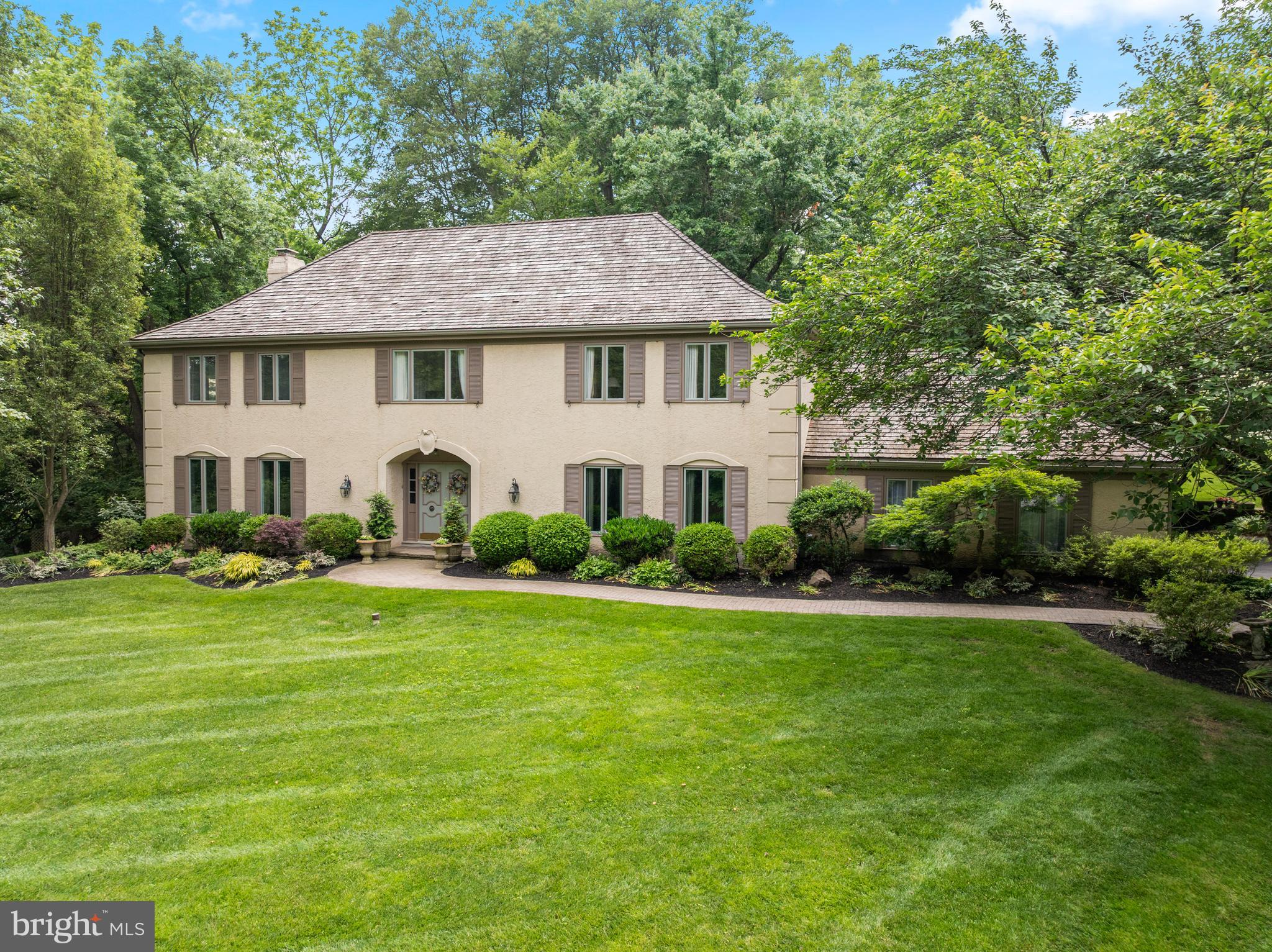 OPEN HOUSE CANCELLED. Welcome to 130 Hunt Valley Circle in the bucolic, sought-after neighborhood of Newtown Hunt in Berwyn. This gracious center hall colonial features 4 bedrooms, 2 full and 2 half bathrooms and a finished lower level nestled on a picturesque 1.38 acre lot with public sewer and a GENERATOR and new A/C in June 2025.. As you walk up the pavered walkway and enter through the double doors, you are greeted by a welcoming foyer, with parquet wood flooring and flanked by the living room and formal dining room. To the left is the inviting living room with ample windows to take in the natural beauty outside. The formal dining room is a perfect setting for hosting dinner parties and boasts chair rail and crown moldings. The eat-in kitchen features hardwood floors, white cabinets, stainless steel appliances, built-in desk, and a peninsula with granite countertops. The breakfast room boasts built-ins to house your dishes and cookbooks and has a sliding door to access the lovely covered porch, a great outdoor living space! The charming family room has a beautiful stone gas fireplace with built-ins and a slider to the covered porch for summer entertaining. A 2 car attached garage, a mudroom with washer & dryer and a convenient second powder room complete this floor. On the second level, the expansive primary suite serves as a personal sanctuary, complete with a huge bedroom, a sitting area, walk-in closet, and private office. Indulge in the luxurious primary bathroom, featuring a jetted tub, stall shower, bidet, and double vanity. There are three additional generously sized bedrooms and a hall bathroom with a new vanity and tub/shower combo. The finished lower level is perfect for hosting fun gatherings, like watching football or game night, featuring a large recreation room with a walk-up wet bar and mini beverage fridge. Adjacent to this, a cozy man cave awaits, featuring dedicated wine storage and a wine refrigerator, making it the perfect retreat for relaxation. This lovely, well maintained home offers a unique blend of privacy and community in a private park-like setting & great convenient location! Close to the prestigious Episcopal Academy and award winning Marple Newtown Schools.