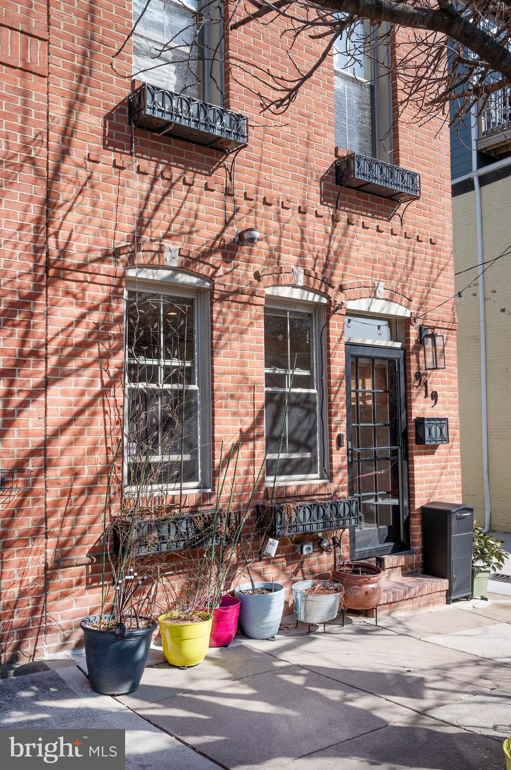 Schedule your appointment today for this three story row house in Canton. This updated home is within walking distance to restaurants, bars, shopping and the waterfront.  It is an end unit, so there is plenty of natural lighting. The house is wired for Ethernet and the second floor features 2 bedrooms/offices and 2 bathrooms, making it ideal for teleworkers. The 3rd floor has the primary bedroom, bathroom and sitting area with a fireplace. The rooftop patio is perfect for relaxing with a drink from the 3rd floor wet bar, watching the sunset, fireworks, or the Blue Angels during Fleet Week. The updated kitchen showcases beautiful cabinetry and also includes a 19th century Champaign “riddling rack”. Some of many updates include a new water heater, a new sump pump,  a new energy saving Mitsubishi mini split HVAC system and a new silicone roof, maintenance free for up to 20 years! The house is hard wired for powered ethernet (PoE) and all rooms have Ethernet ports. There is plenty of parking  and Harmony Ct. is considered a street so it is maintained by the city! On top of all of this the rear alley recently redone by city. You will not be disappointed when you tour this home!