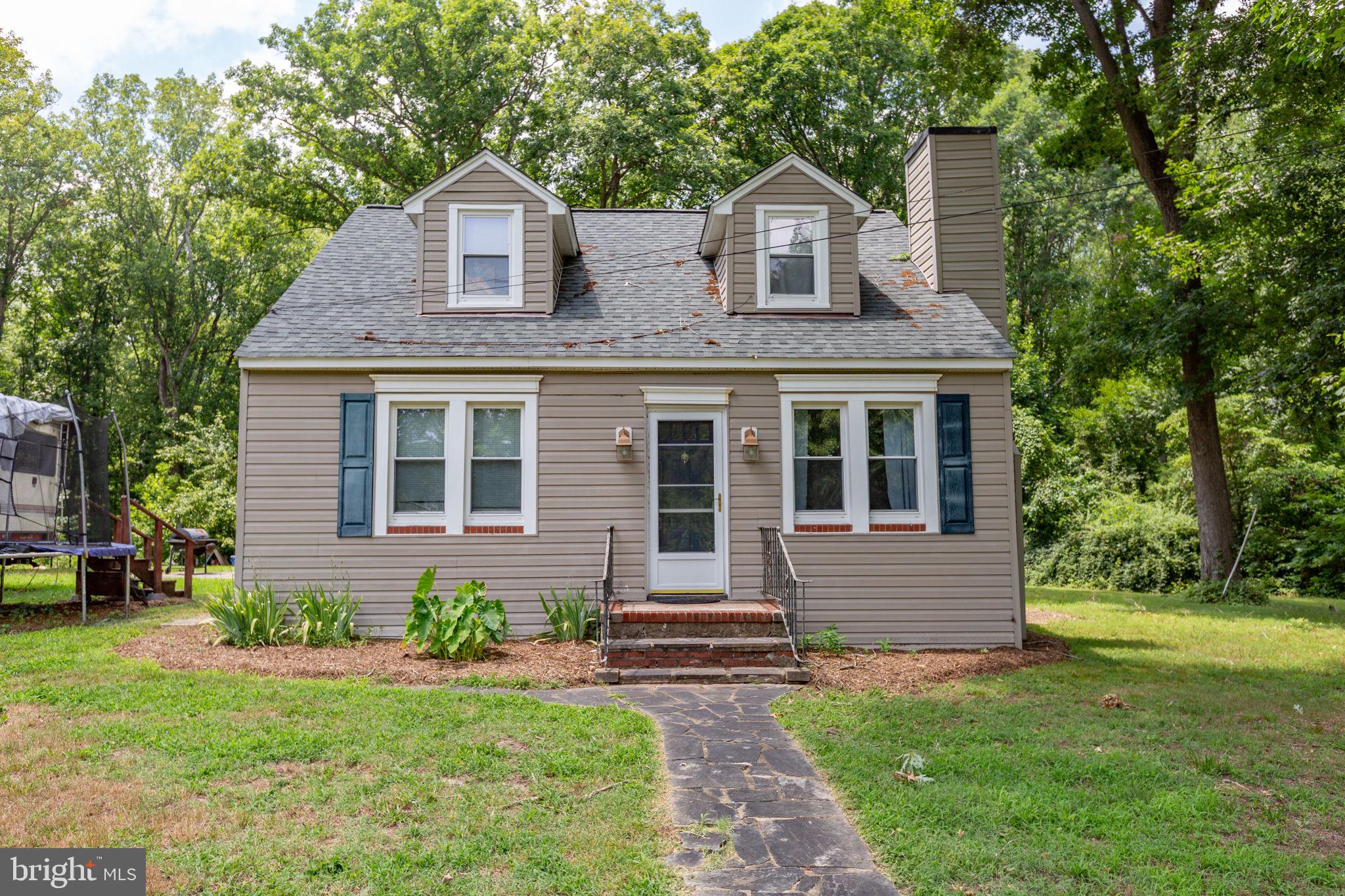 Open House Sunday July12th 11-2!!!!!  Welcome to this charming Cape Cod-style home situated on 2 peaceful acres! This property features 2 bedrooms on the main level, plus an additional upstairs bedroom and a bonus room currently being used as a 4th bedroom (NTC). The home offers 1.5 baths, an updated kitchen with beautiful butcher block countertops, and a double spacious pantry. Enjoy the bright sunroom and convenient first-level laundry room. Recent updates include a newer roof. Being sold AS IS, this home offers a great opportunity for buyers looking to add their personal touch and build equity. With a little TLC, this property could make a wonderful starter home or investment opportunity! Sellers are Very Motivated!